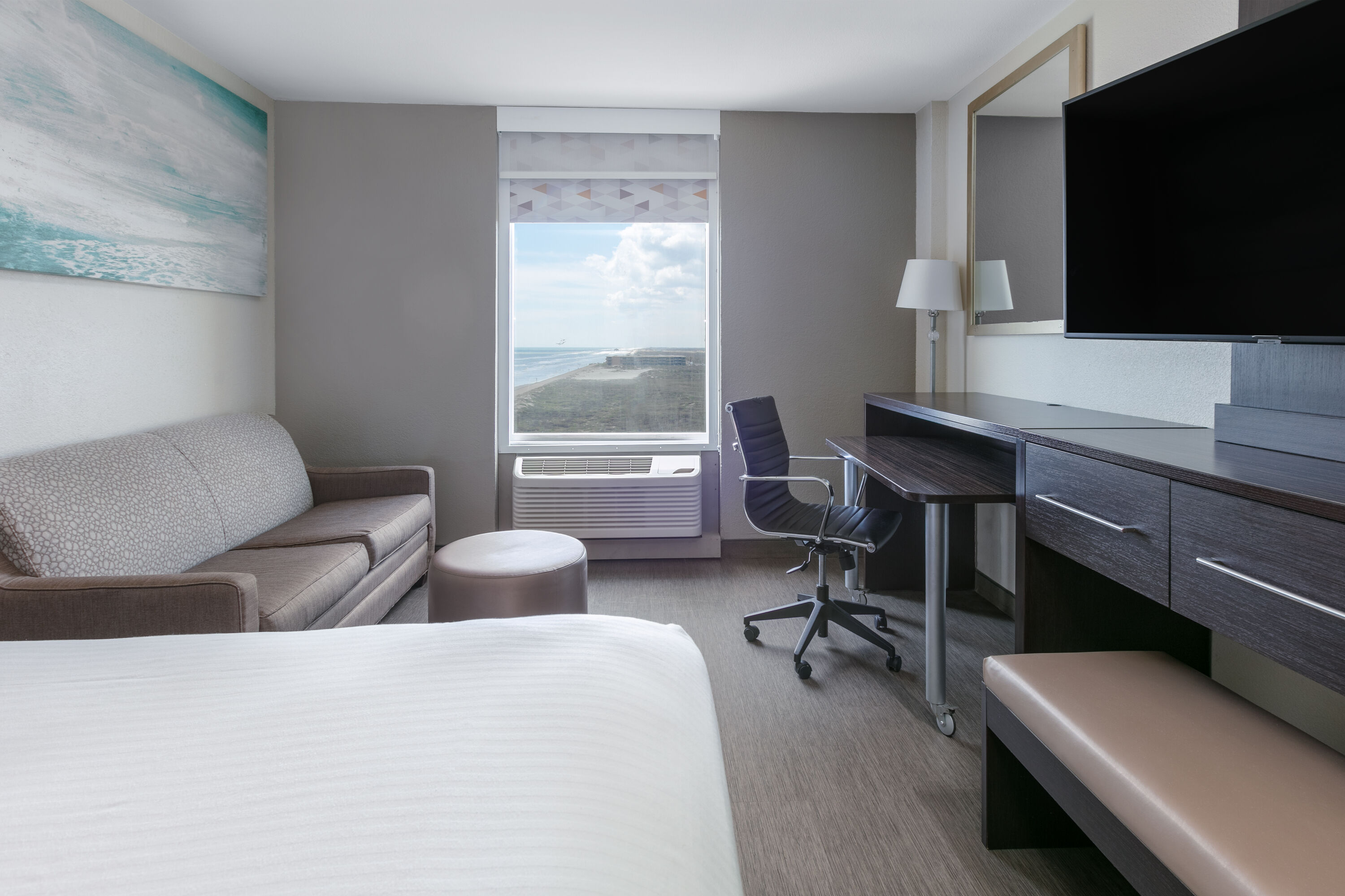 King bed guest room at the Wyndham Corpus Christi Resort North Padre Island in Corpus Christi, Texas