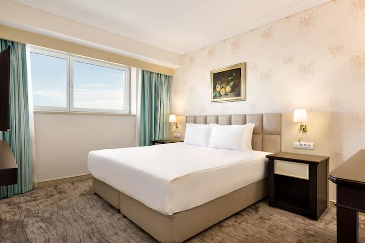King bed guest room at the Wyndham Tashkent in Tashkent, Other than US/Canada