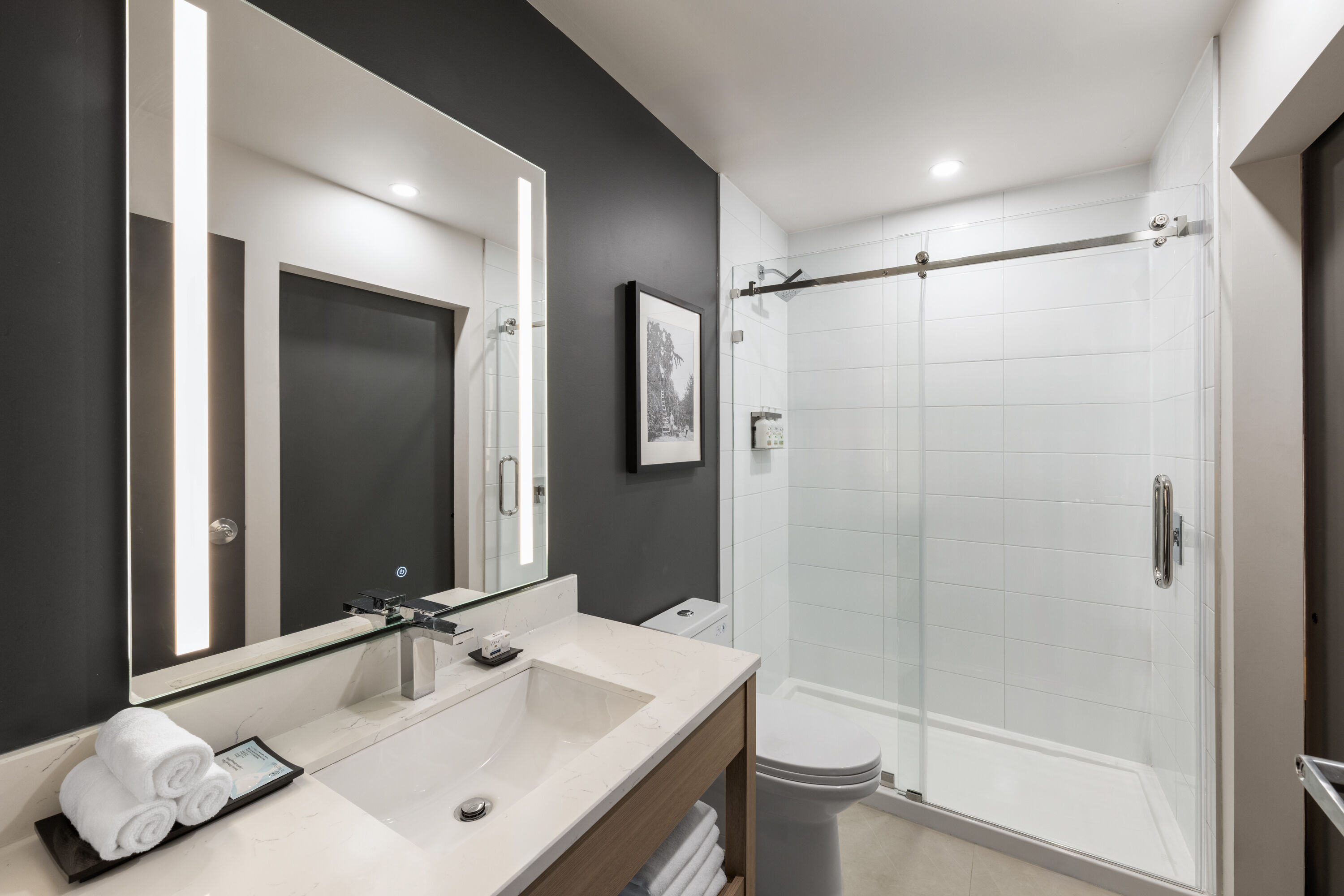 Guest room bath at the La Quinta Inn & Suites by Wyndham Kelowna BC in Kelowna, British Columbia