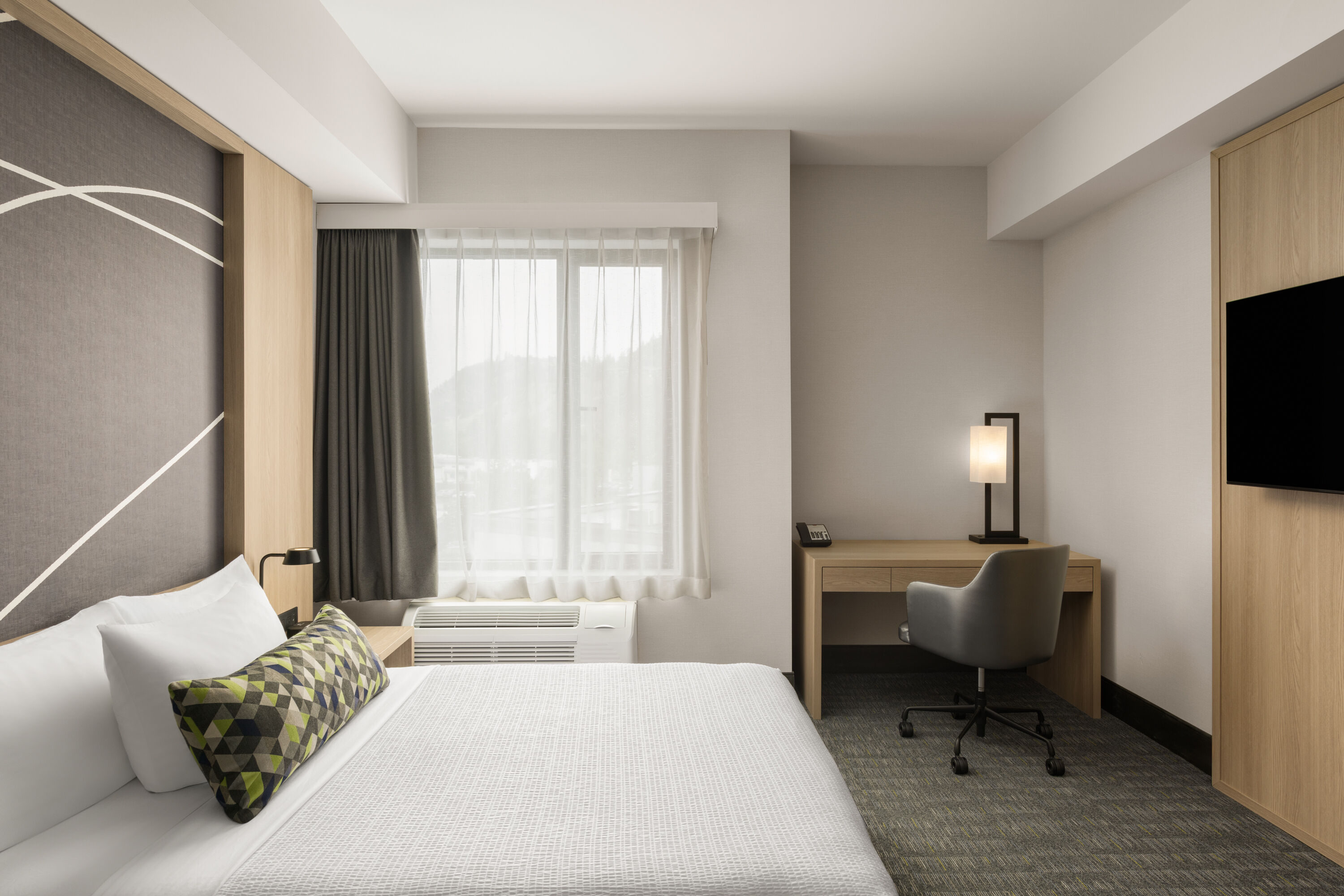 Guest room at the La Quinta Inn & Suites by Wyndham Kelowna BC in Kelowna, British Columbia
