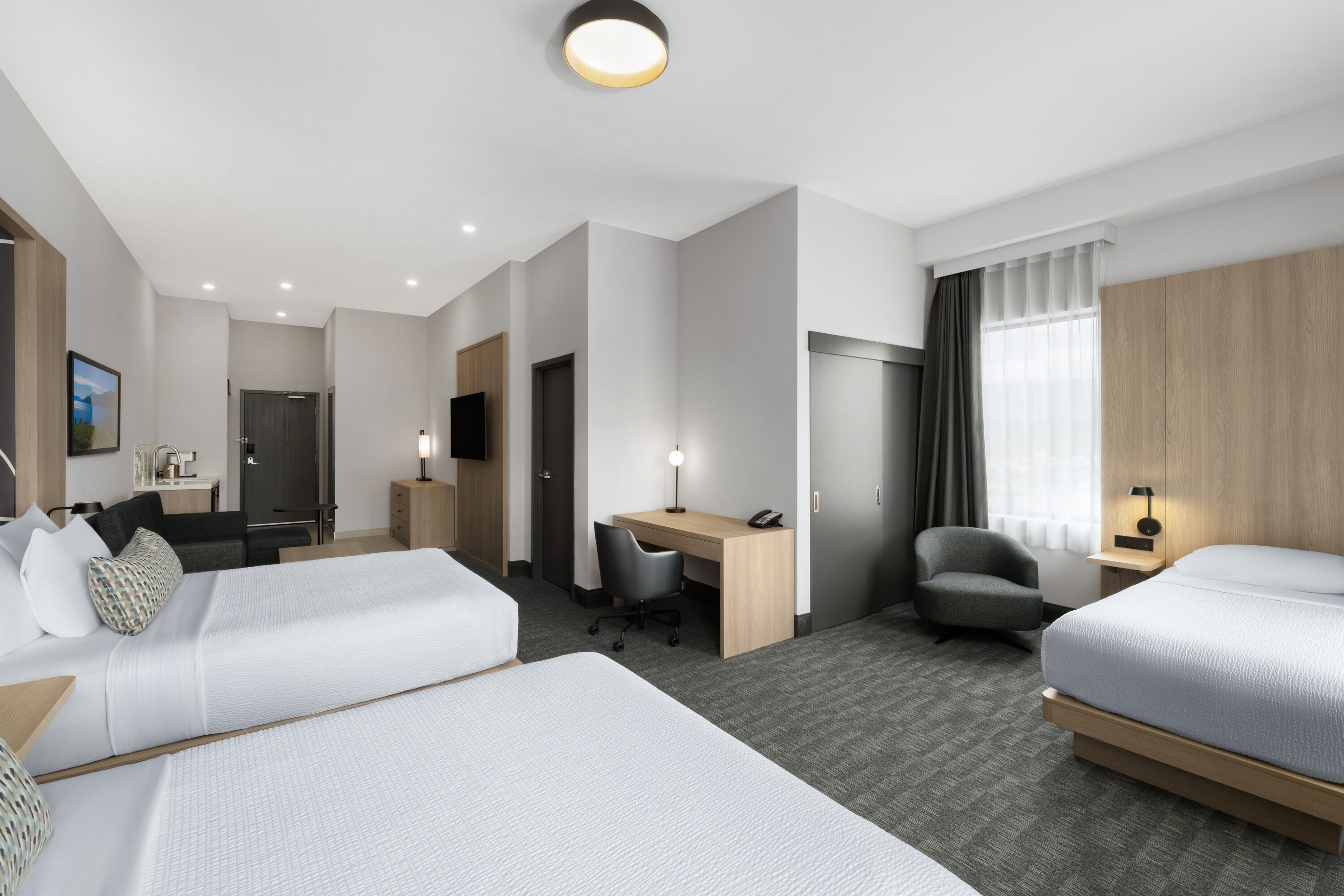 Guest room at the La Quinta Inn & Suites by Wyndham Kelowna BC in Kelowna, British Columbia