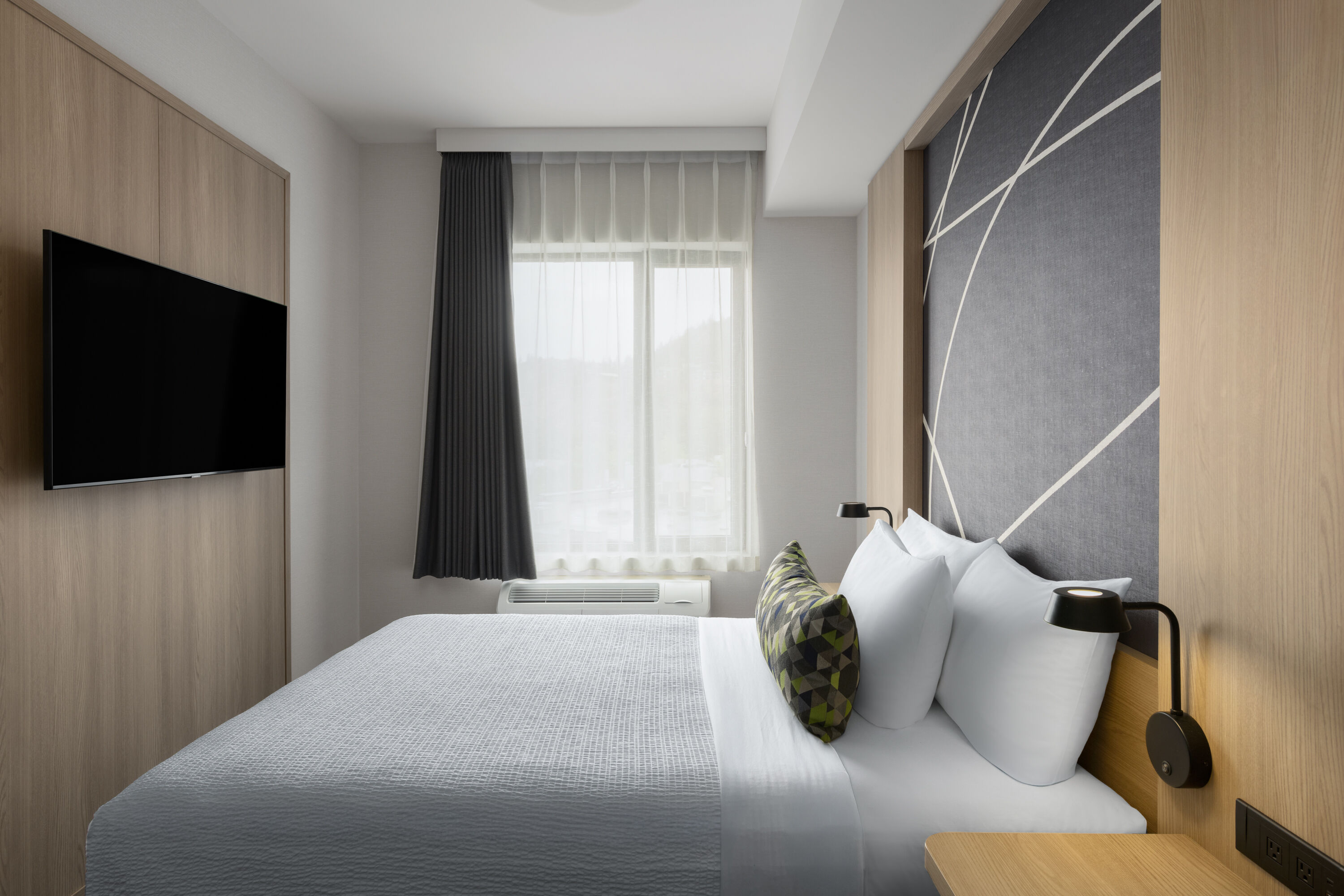 Guest room at the La Quinta Inn & Suites by Wyndham Kelowna BC in Kelowna, British Columbia