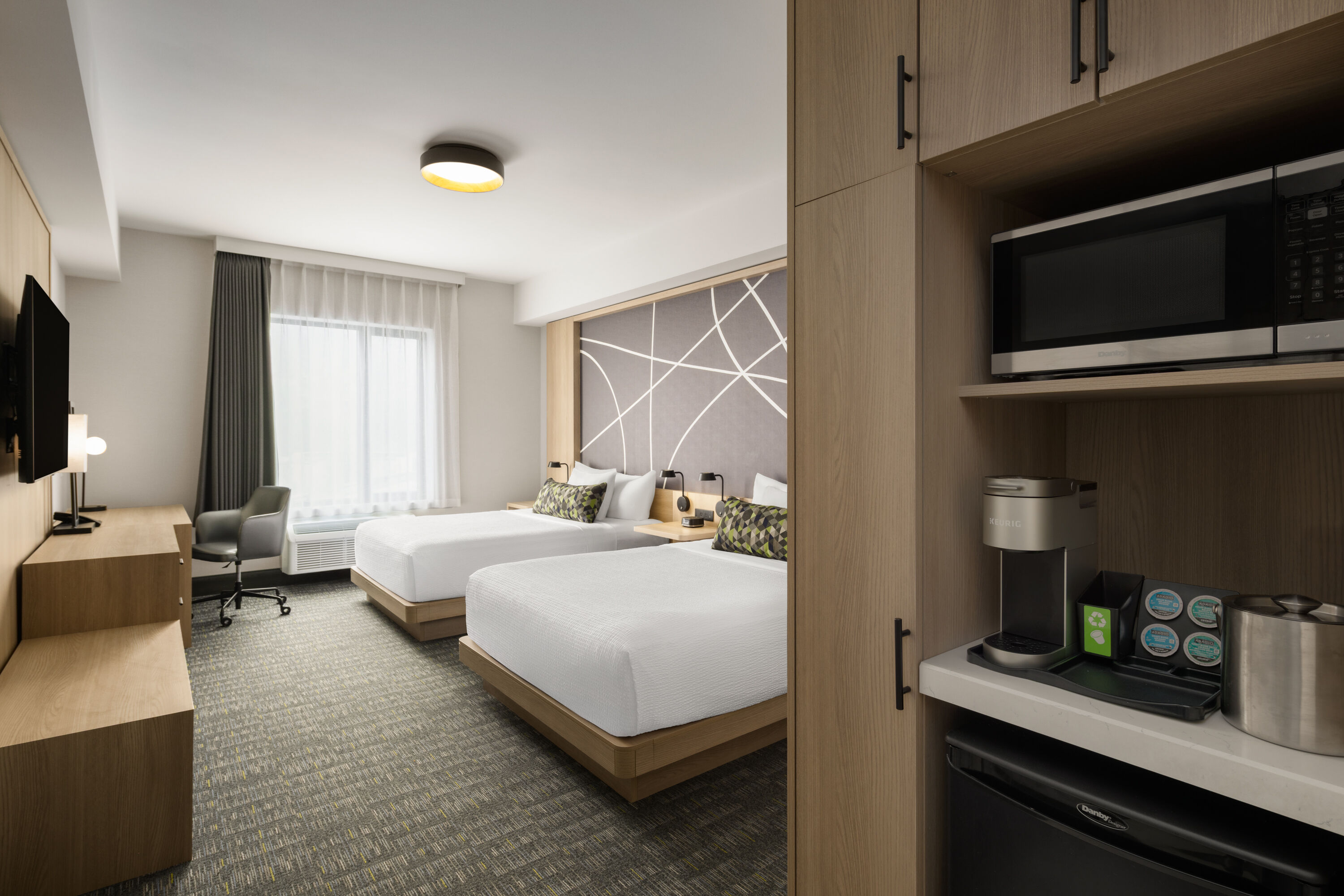 Guest room at the La Quinta Inn & Suites by Wyndham Kelowna BC in Kelowna, British Columbia