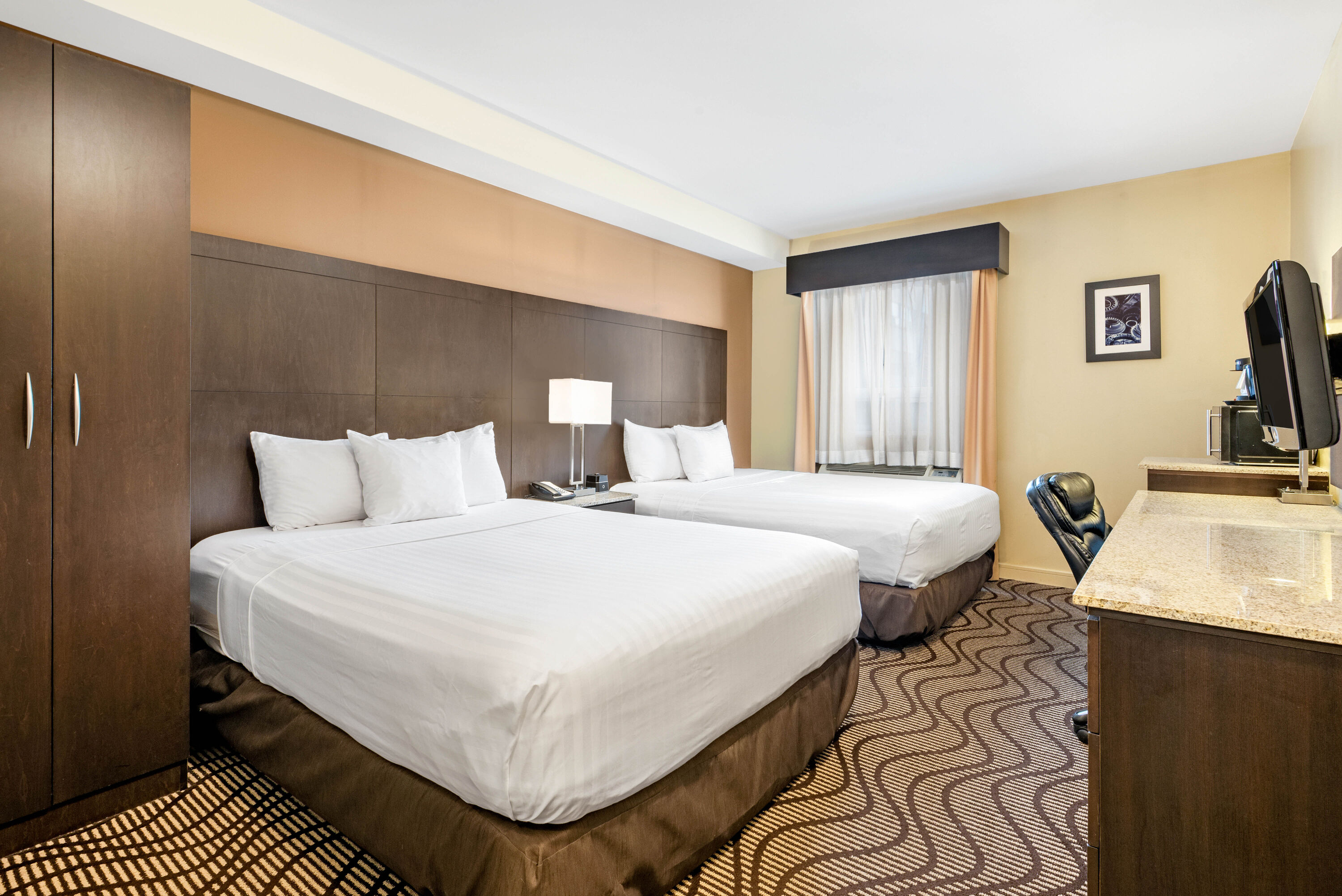 Guest room at the La Quinta Inn & Suites by Wyndham Oshawa in Oshawa, Ontario