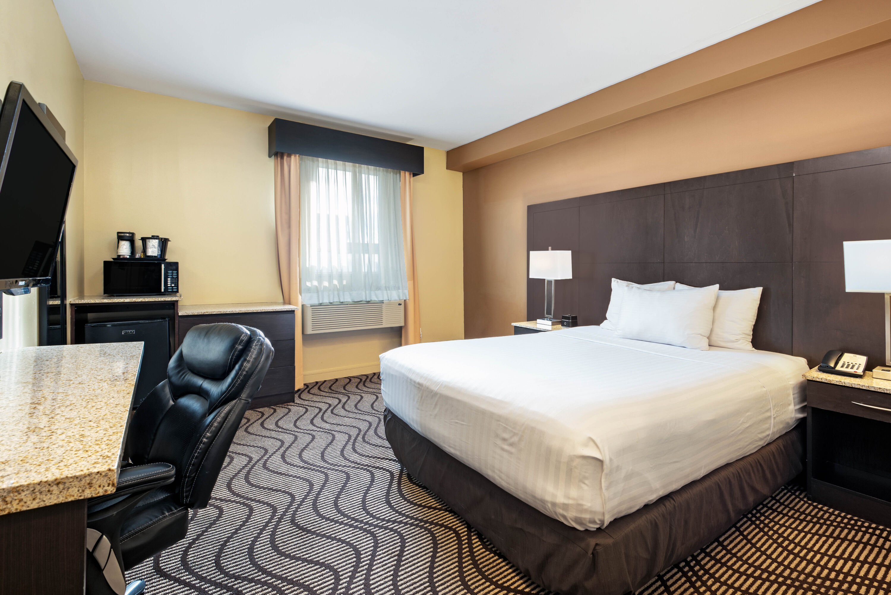 Guest room at the La Quinta Inn & Suites by Wyndham Oshawa in Oshawa, Ontario