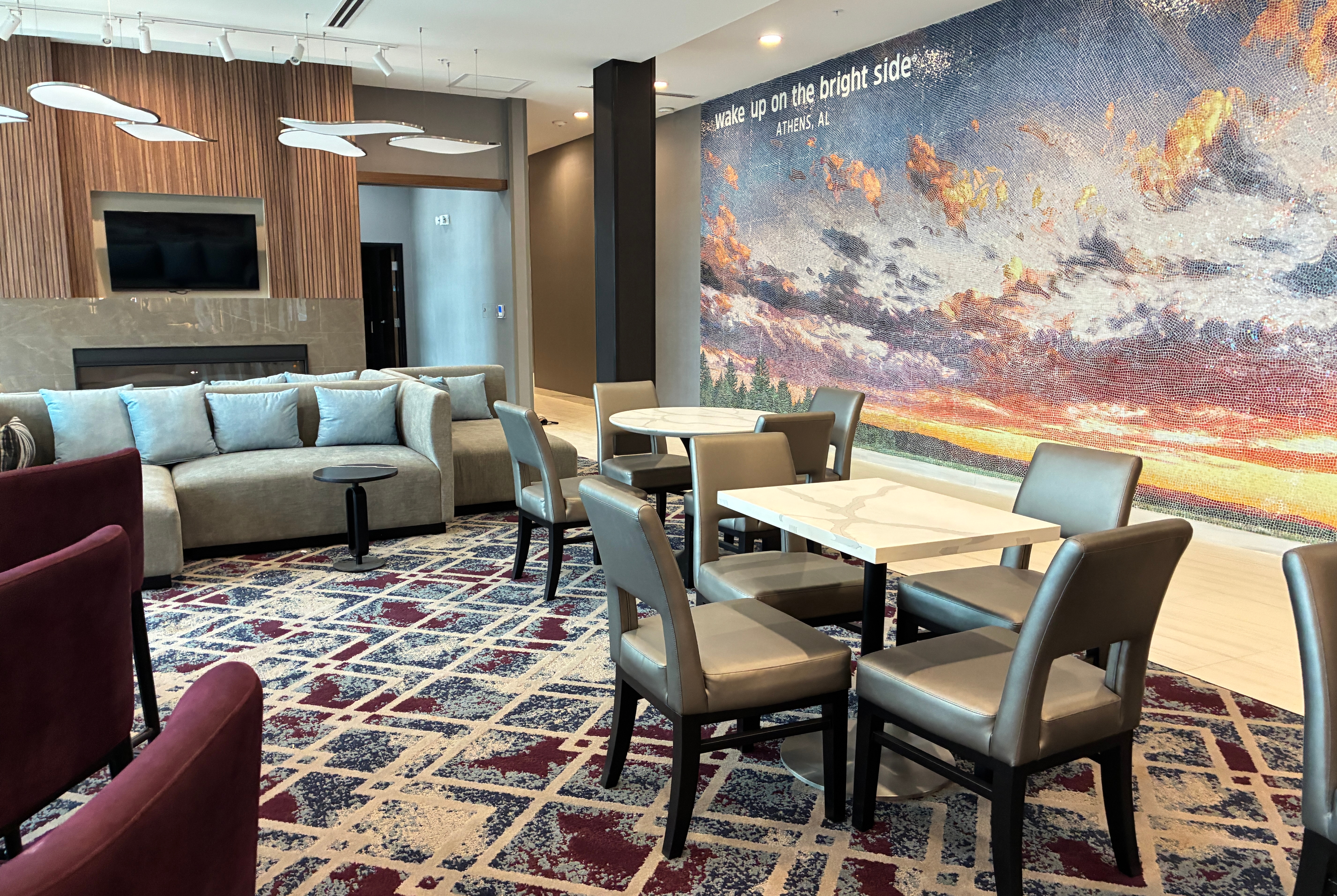 La Quinta Inn & Suites by Wyndham Athens restaurant breakfast area with seating in Athens, Alabama