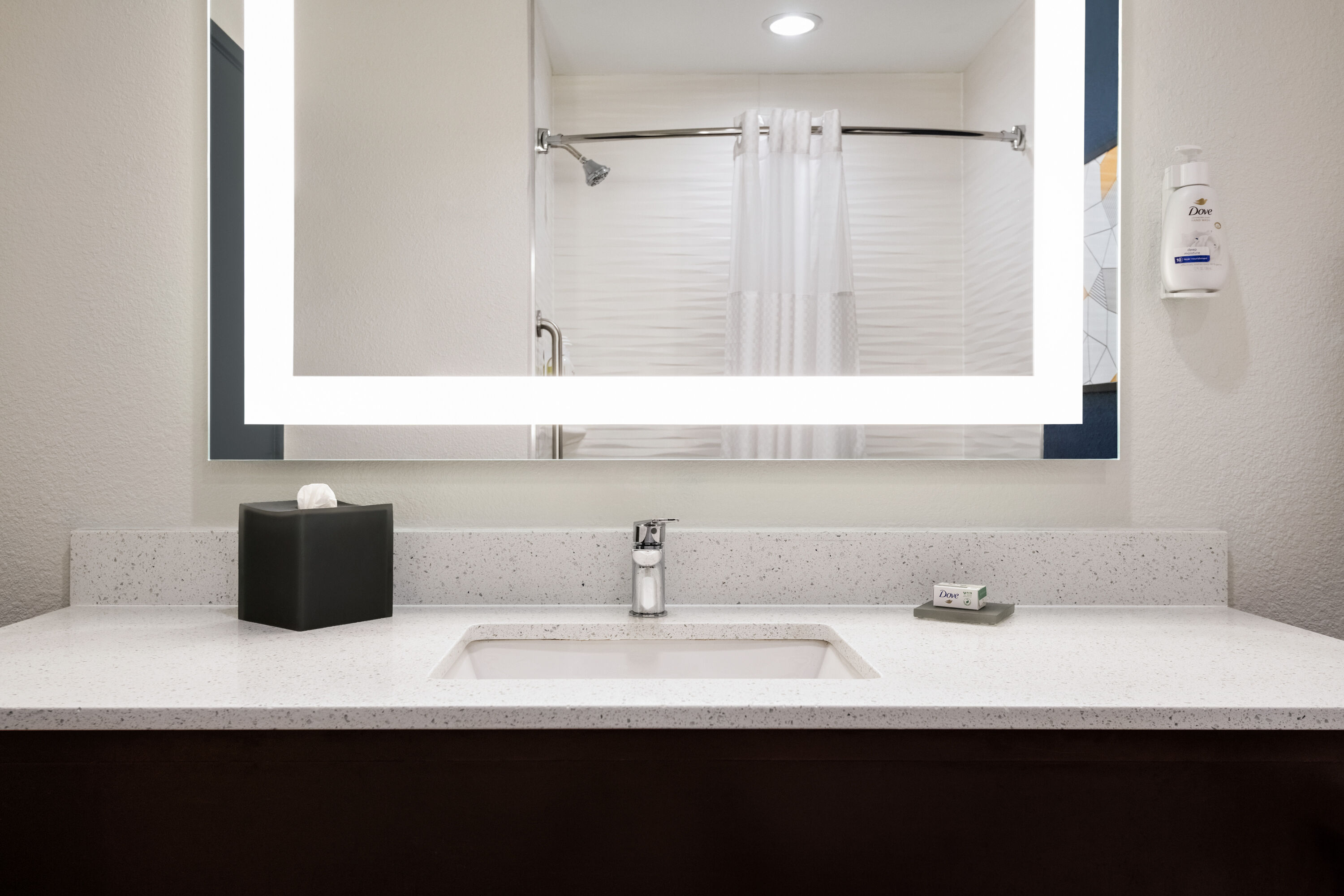 Guest room bath at the La Quinta Inn & Suites by Wyndham Montgomery in Montgomery, Alabama