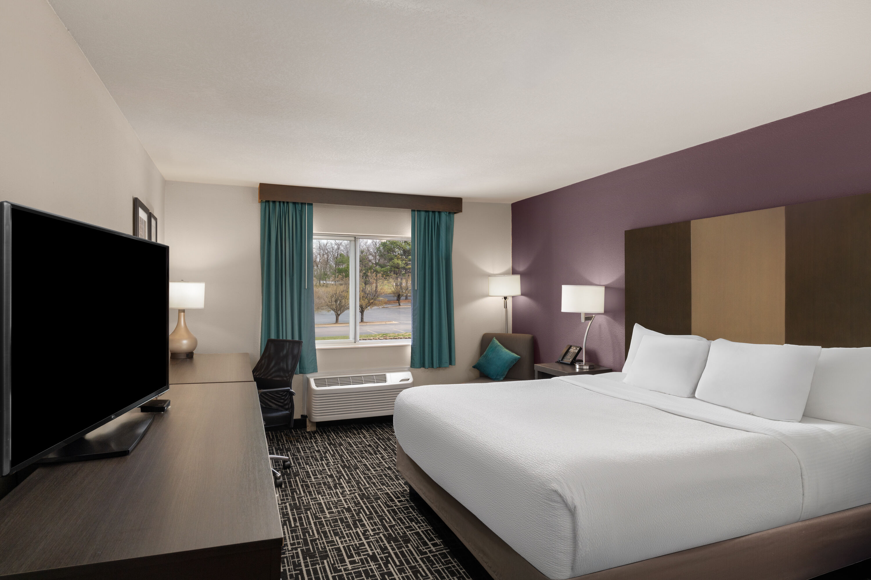 Guest room at the La Quinta Inn & Suites by Wyndham Fayetteville in Fayetteville, Arkansas