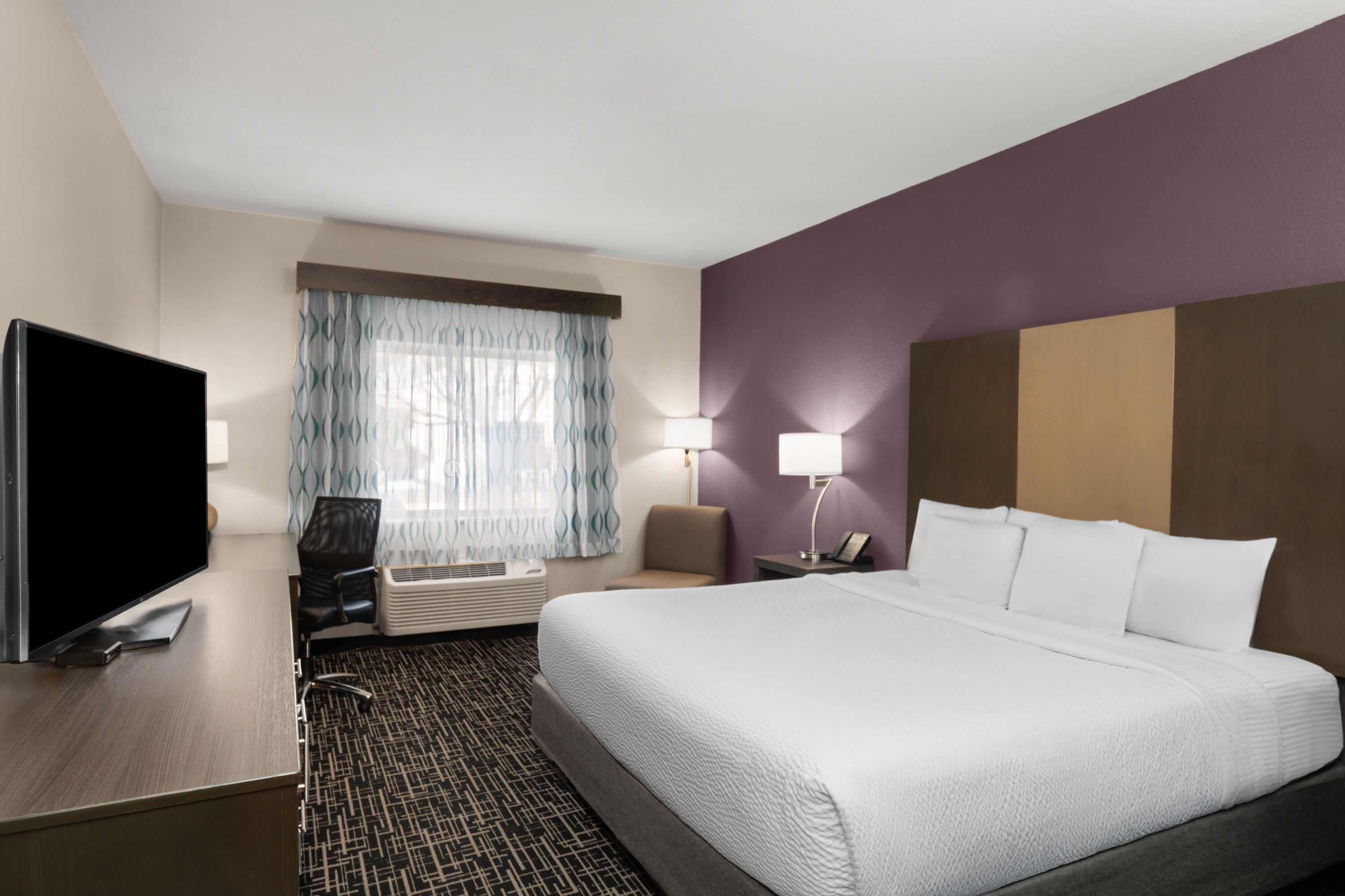 Guest room at the La Quinta Inn & Suites by Wyndham Fayetteville in Fayetteville, Arkansas