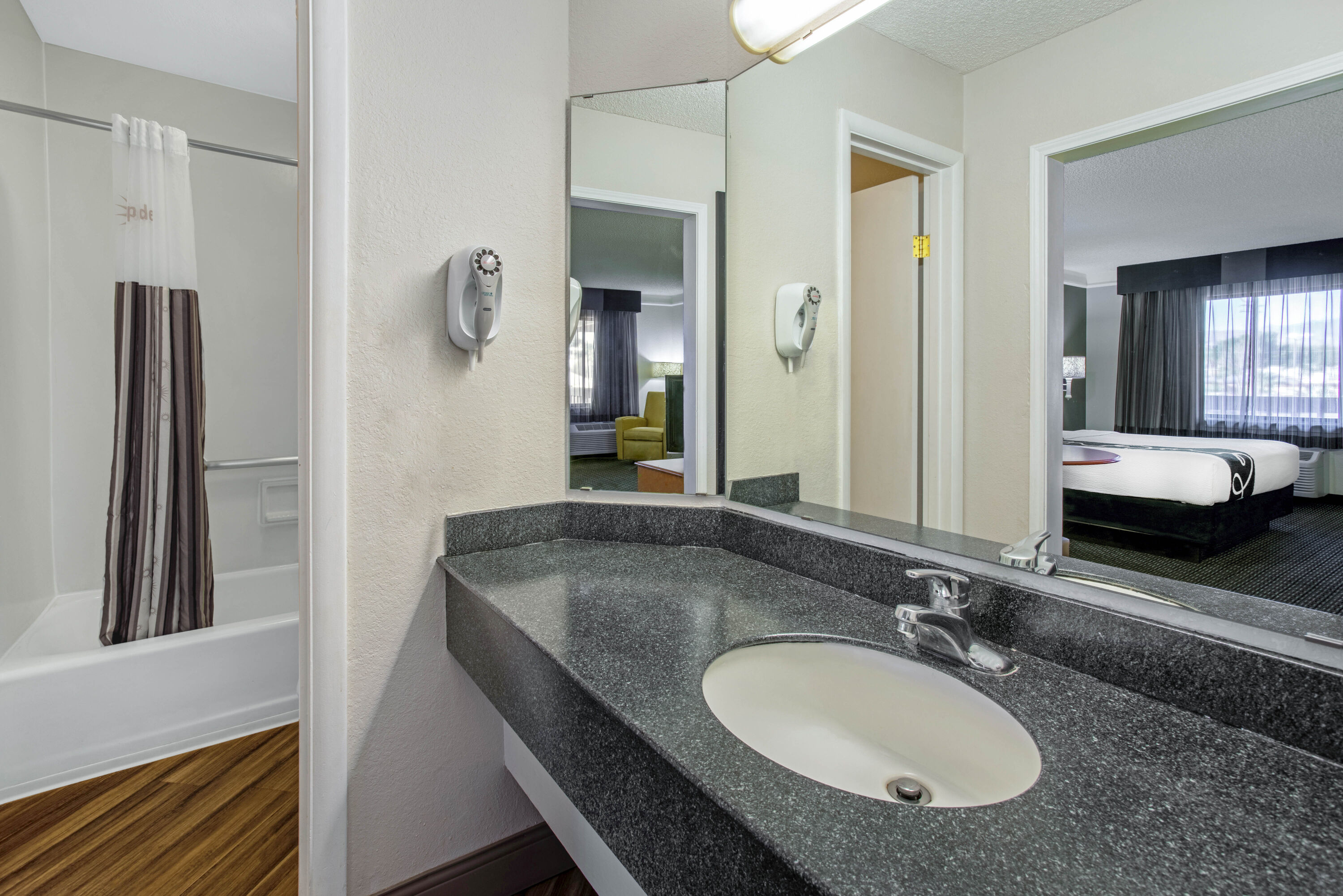 Guest room bath at the La Quinta Inn by Wyndham Tucson East in Tucson, Arizona