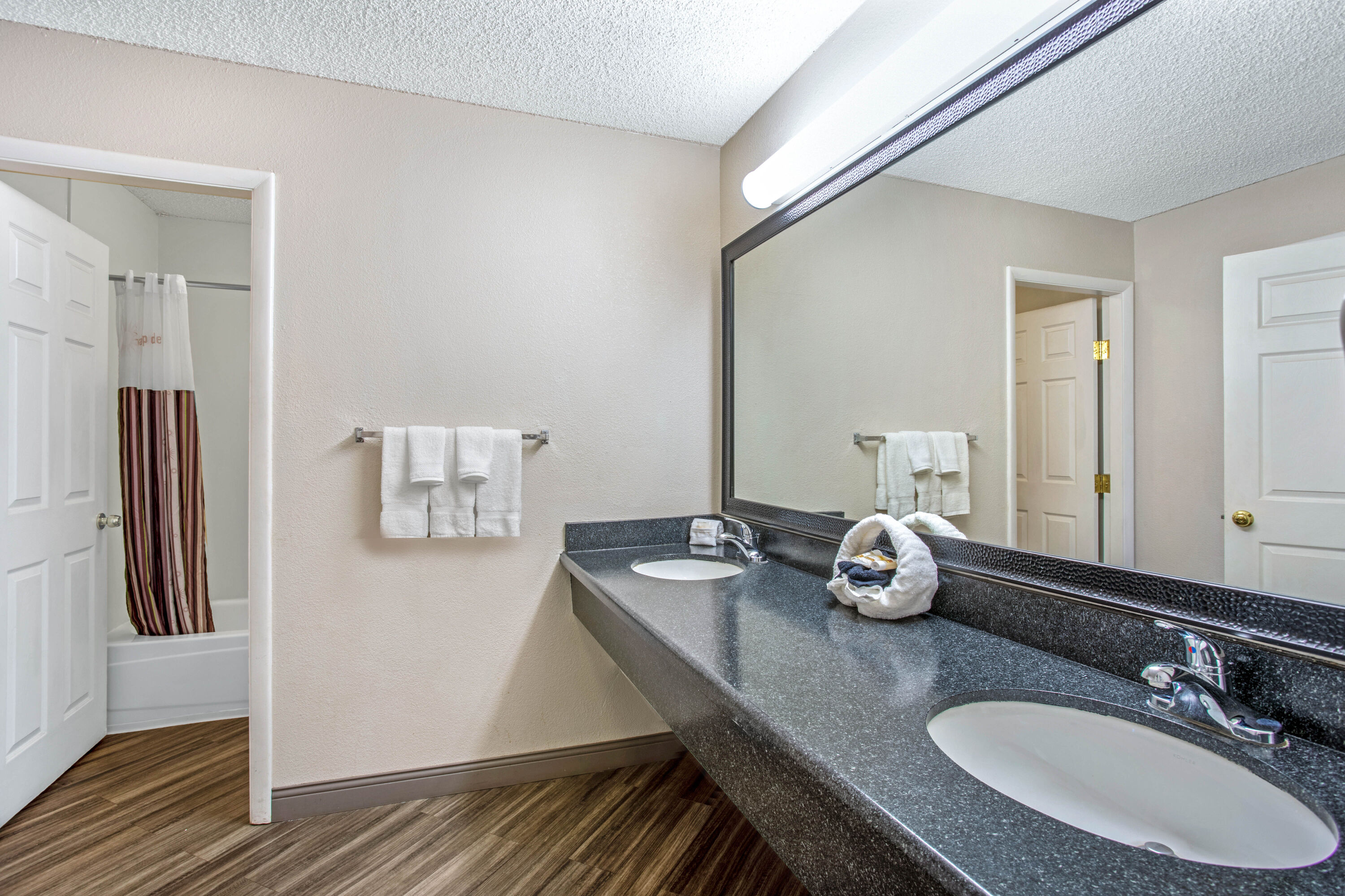 Guest room bath at the La Quinta Inn by Wyndham Tucson East in Tucson, Arizona