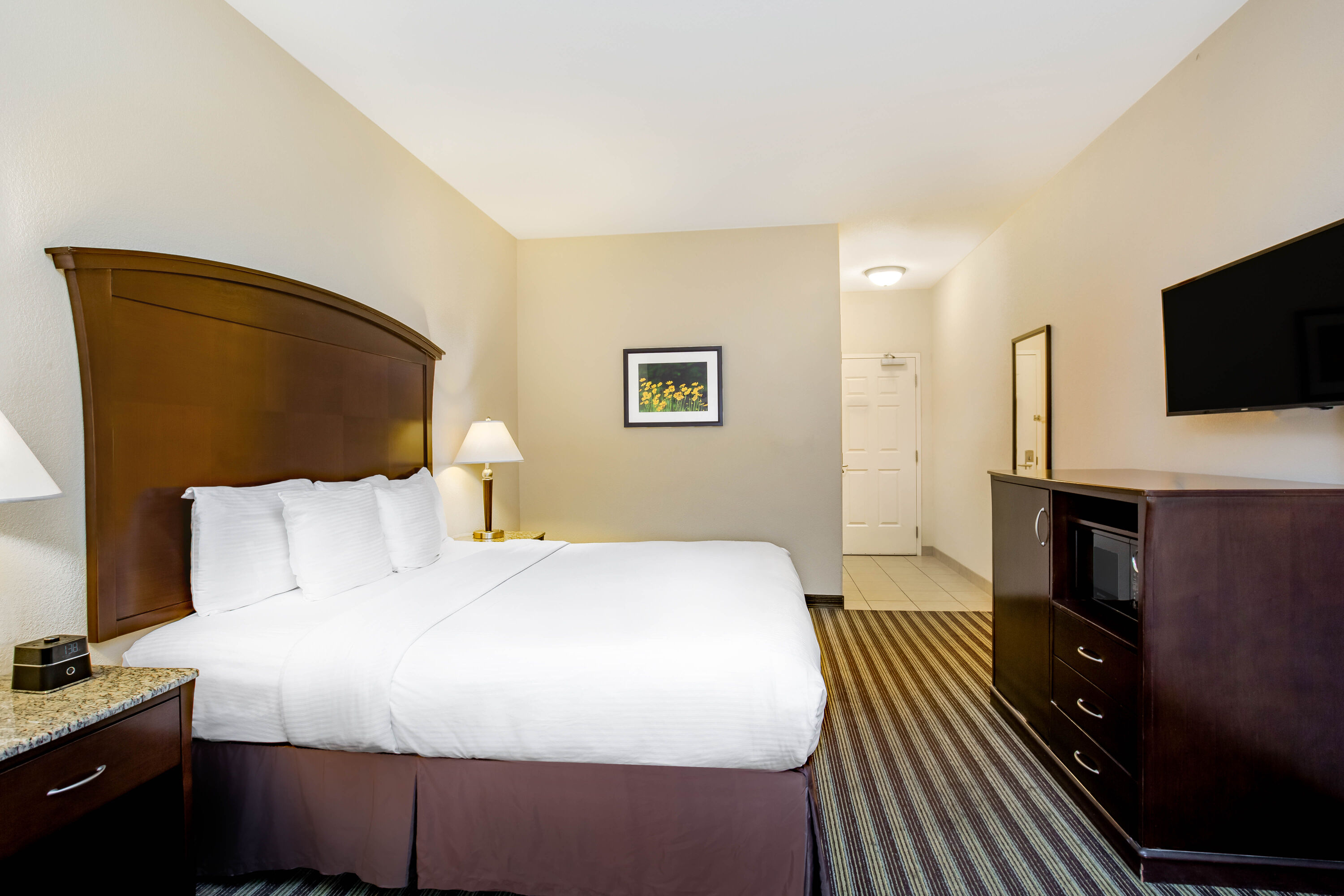 Guest room at the La Quinta Inn & Suites by Wyndham Fowler in Fowler, California