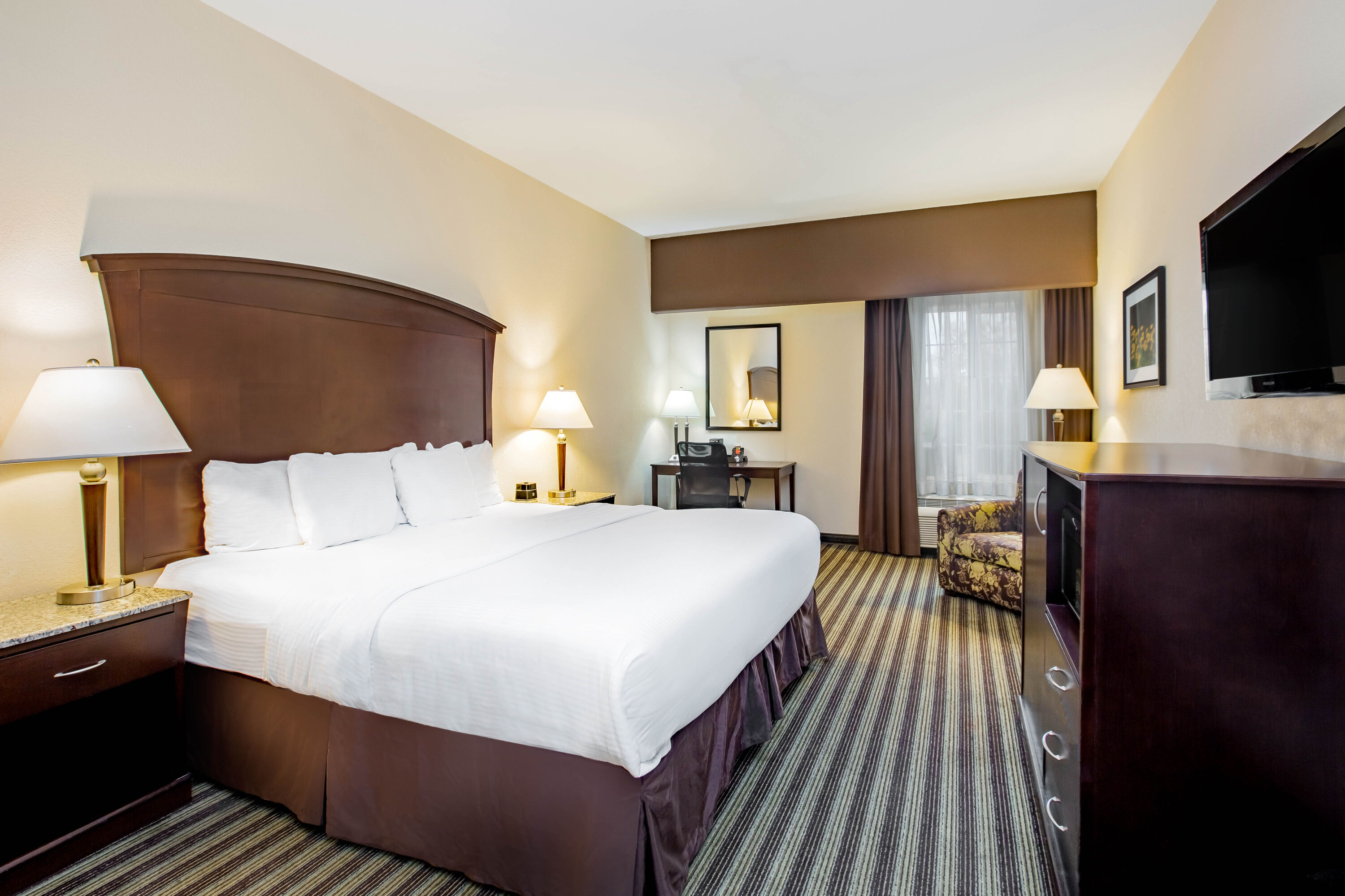 Guest room at the La Quinta Inn & Suites by Wyndham Fowler in Fowler, California