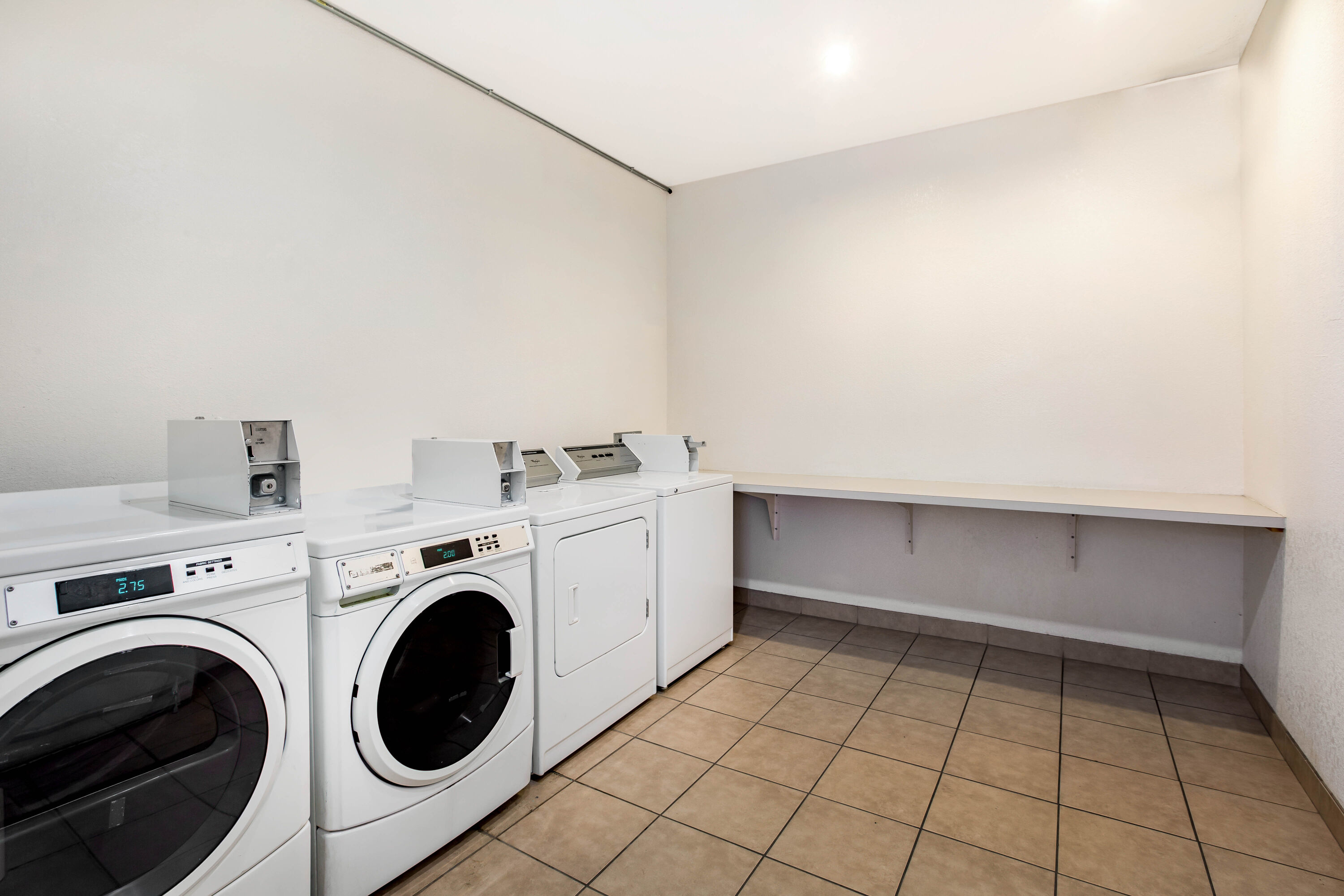 Laundry facilities at La Quinta Inn & Suites by Wyndham Fowler in Fowler, California