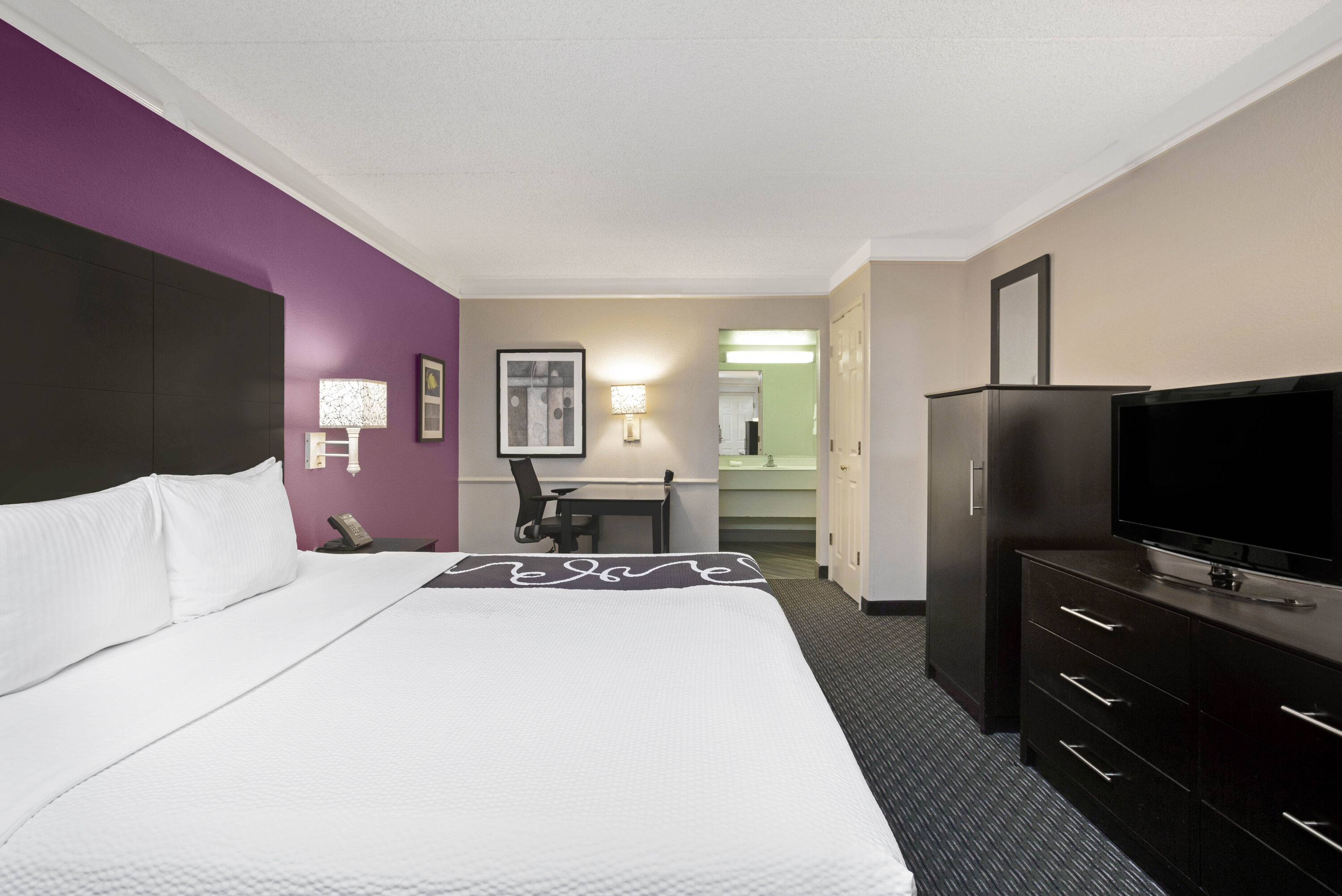 Guest room at the La Quinta Inn by Wyndham Fresno Yosemite in Fresno, California