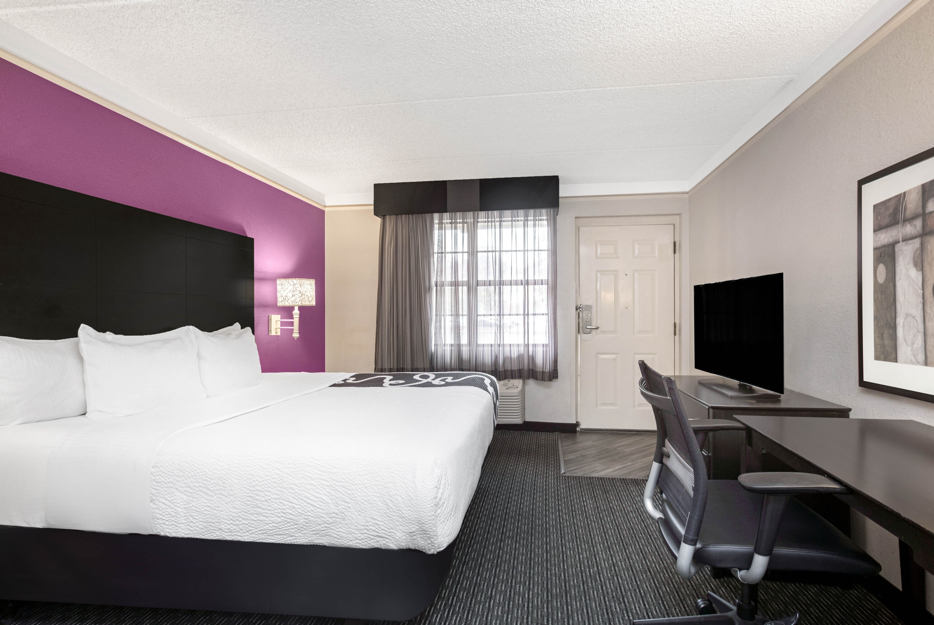 Guest room at the La Quinta Inn by Wyndham Fresno Yosemite in Fresno, California