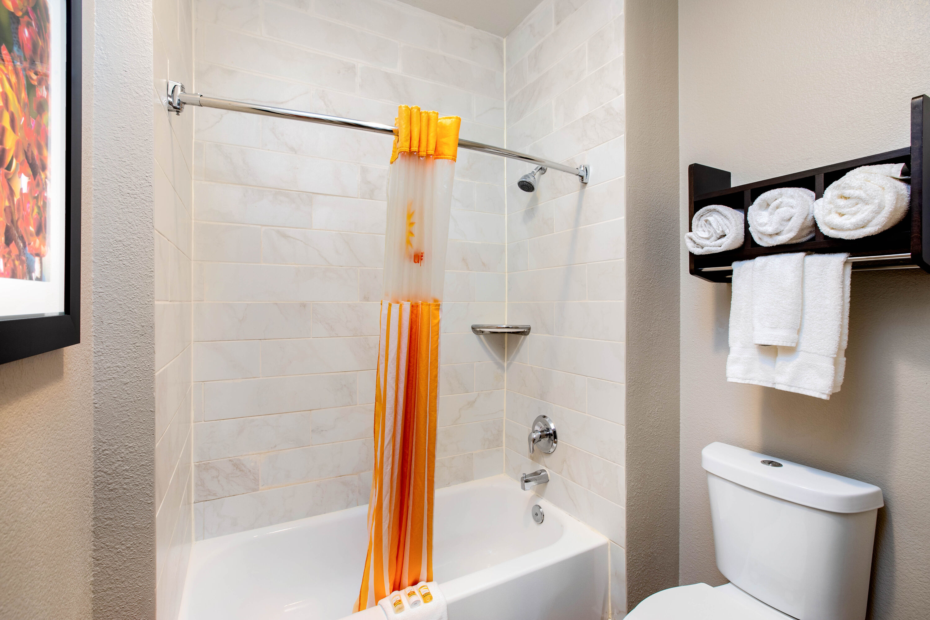 Guest room bath at the La Quinta Inn by Wyndham Livermore in Livermore, California