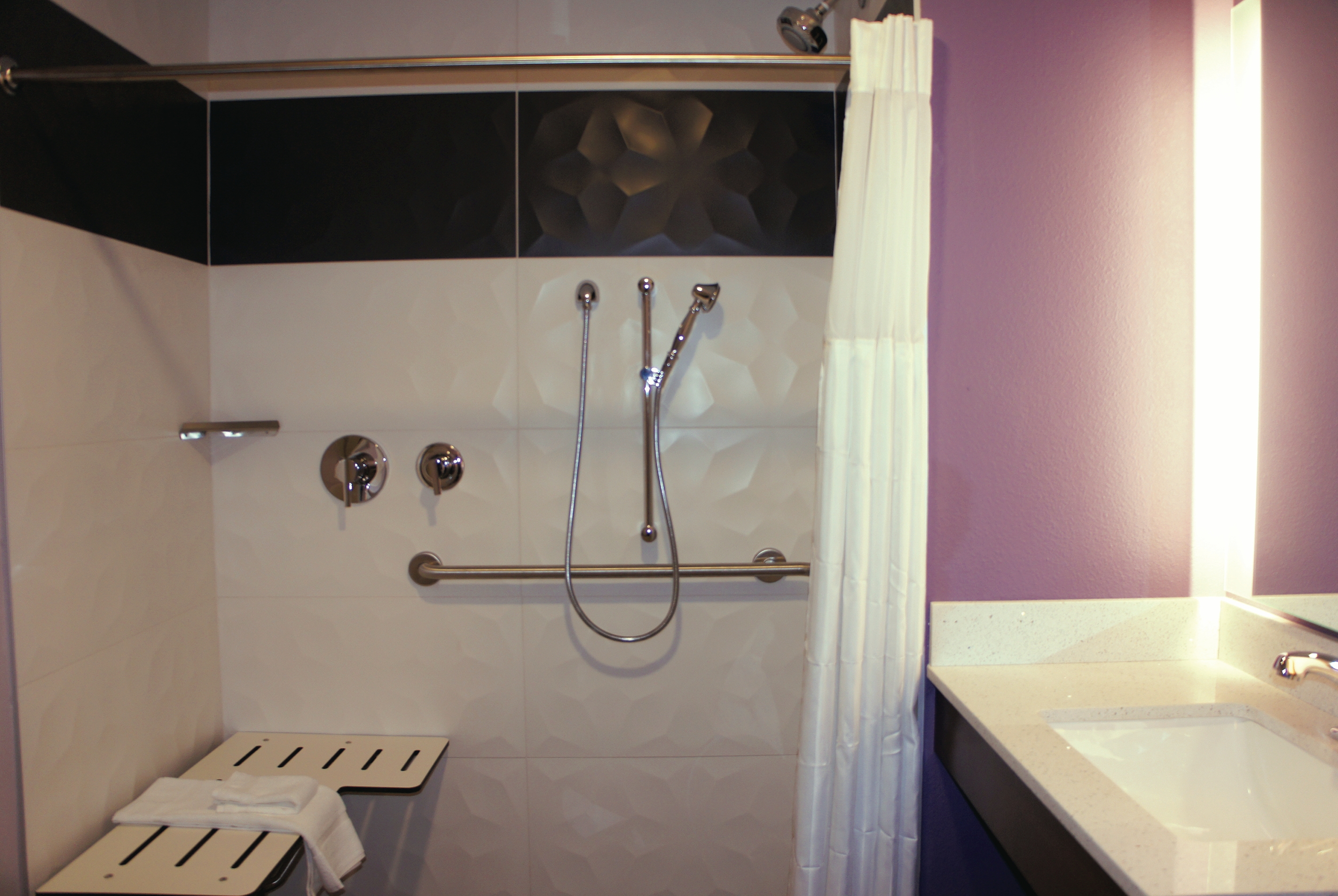 Guest room bath at the La Quinta Inn & Suites by Wyndham Madera in Madera, California