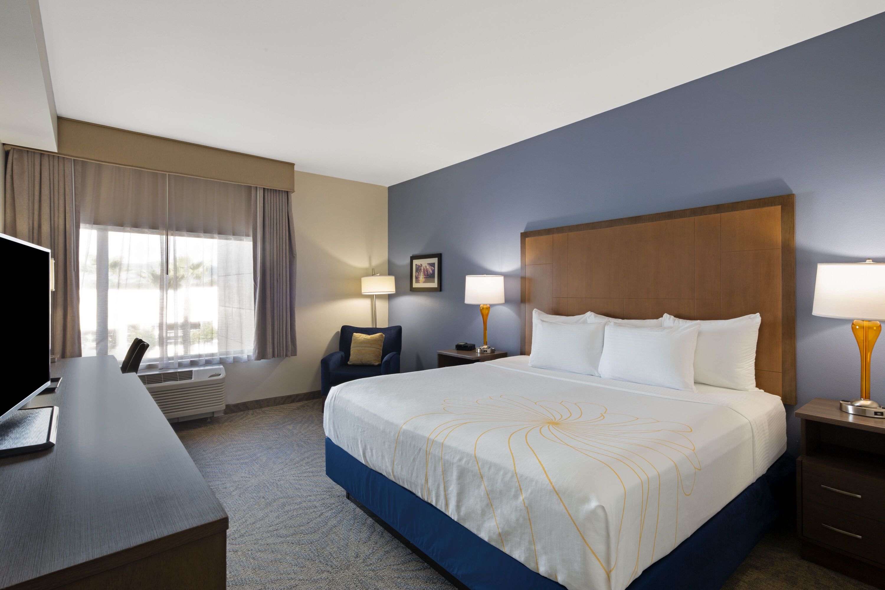 Guest room at the La Quinta Inn & Suites by Wyndham Morgan Hill-San Jose South in Morgan Hill, California