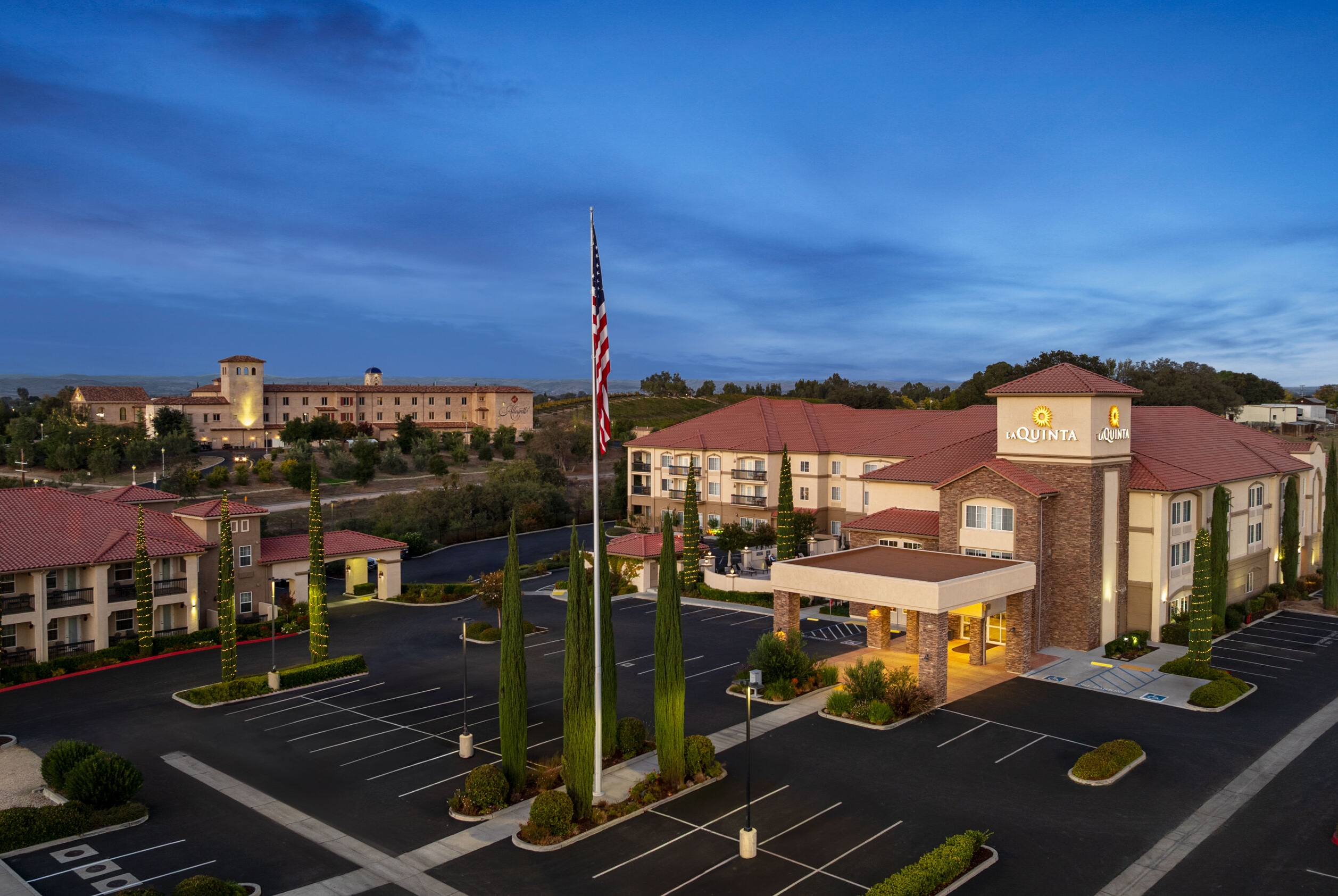 Exterior Dusk Image of La Quinta Inn & Suites by Wyndham Paso Robles hotel in Paso Robles, California