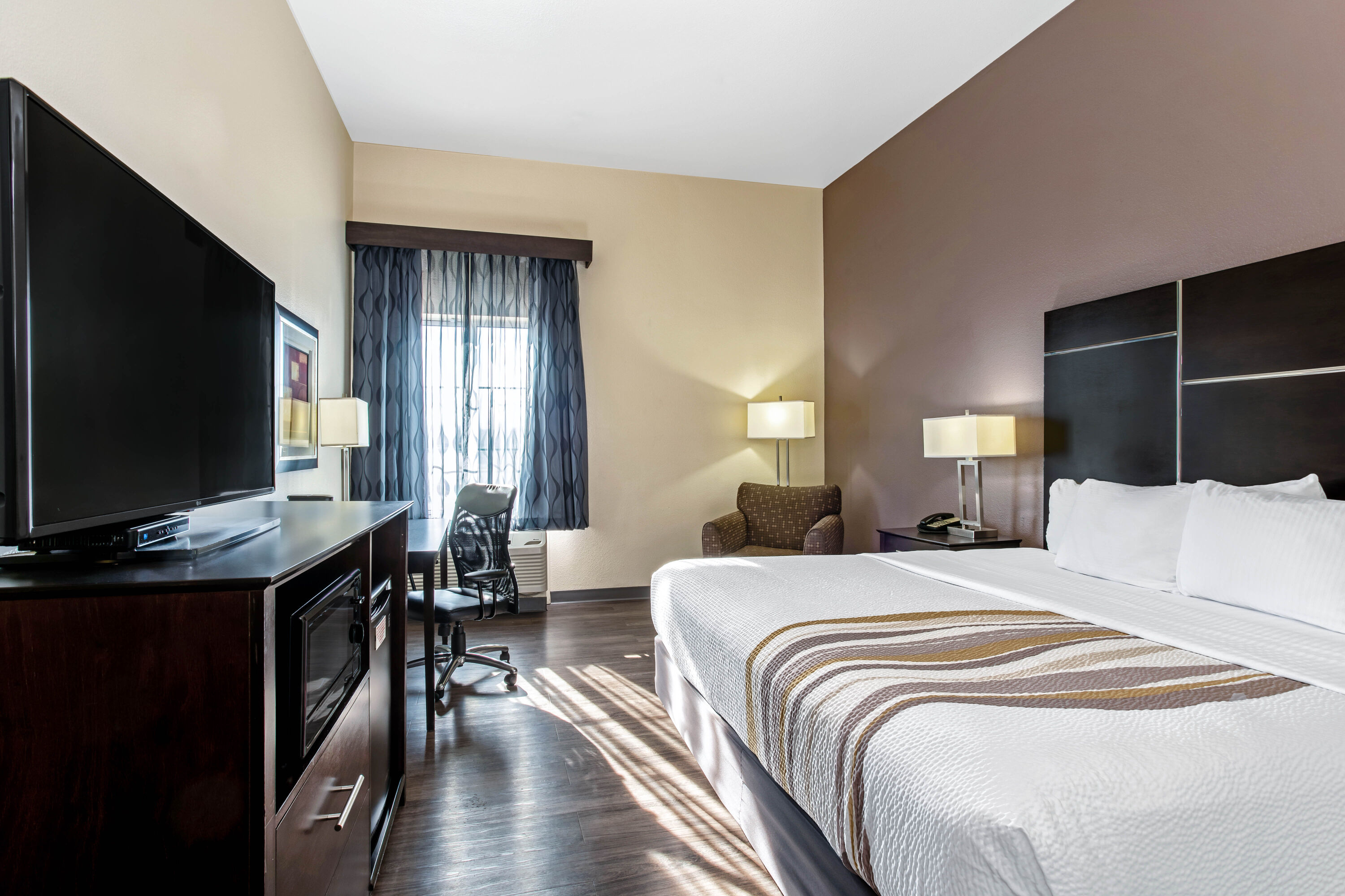 Guest room at the La Quinta Inn & Suites by Wyndham Denver Gateway Park in Denver, Colorado