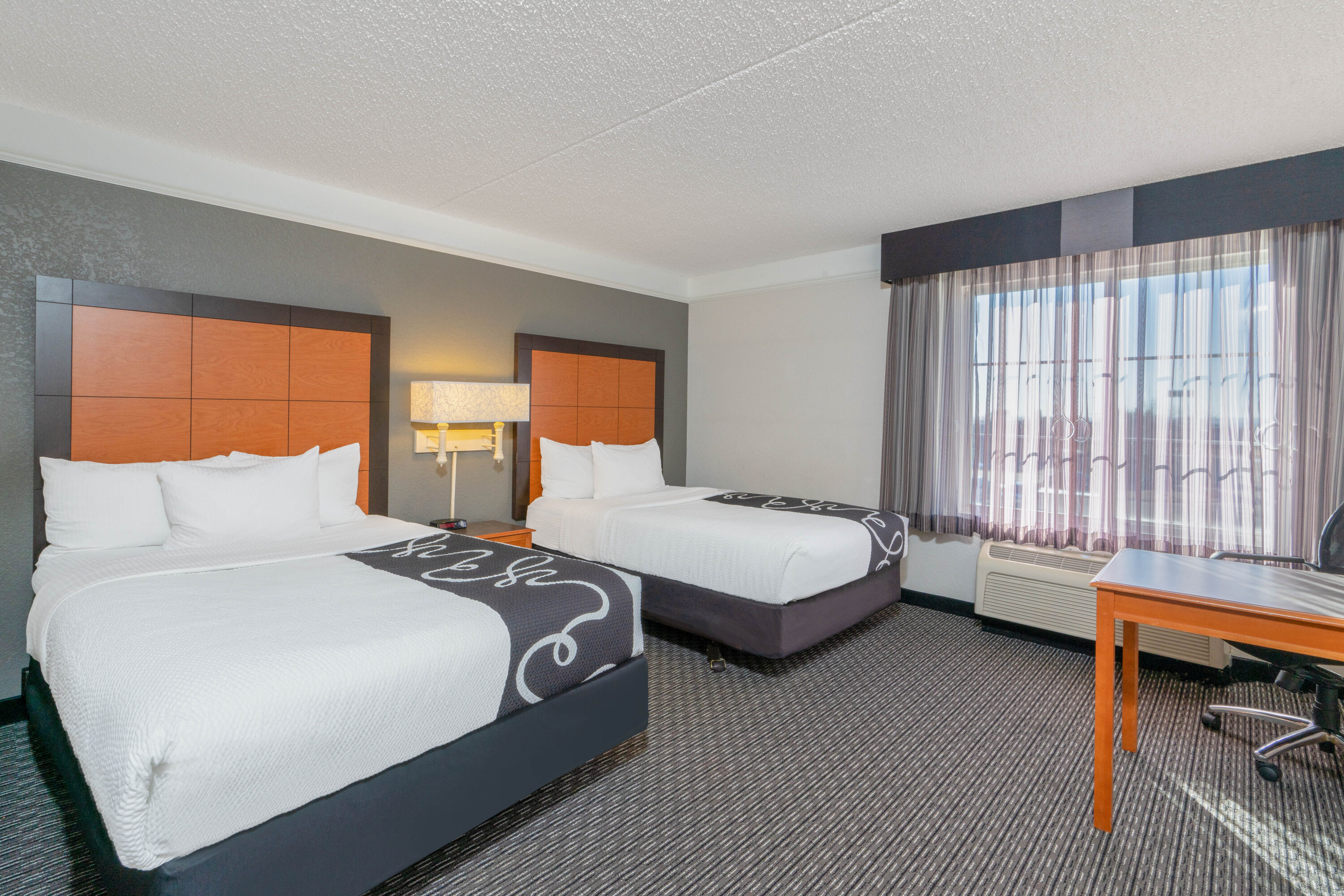 Guest room at the La Quinta Inn & Suites by Wyndham Pueblo in Pueblo, Colorado