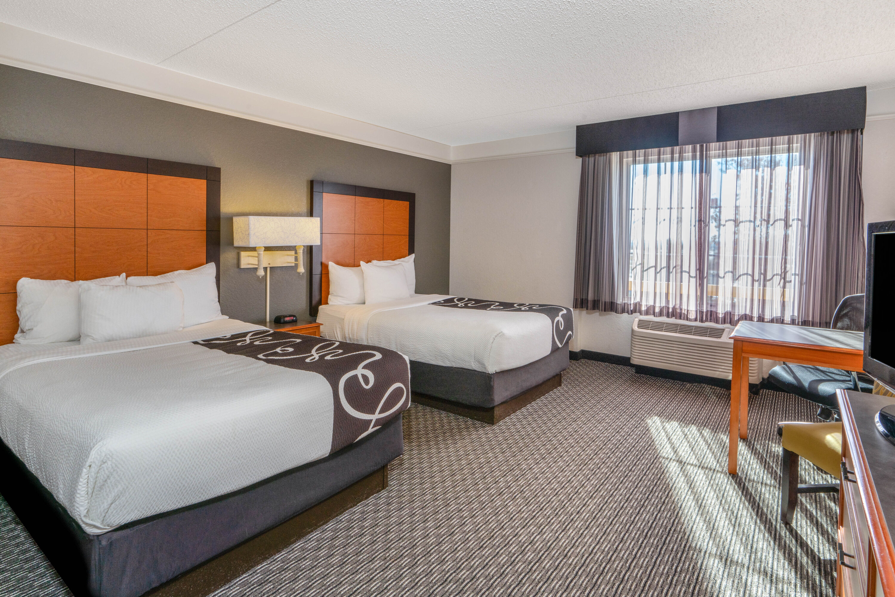 Guest room at the La Quinta Inn & Suites by Wyndham Pueblo in Pueblo, Colorado