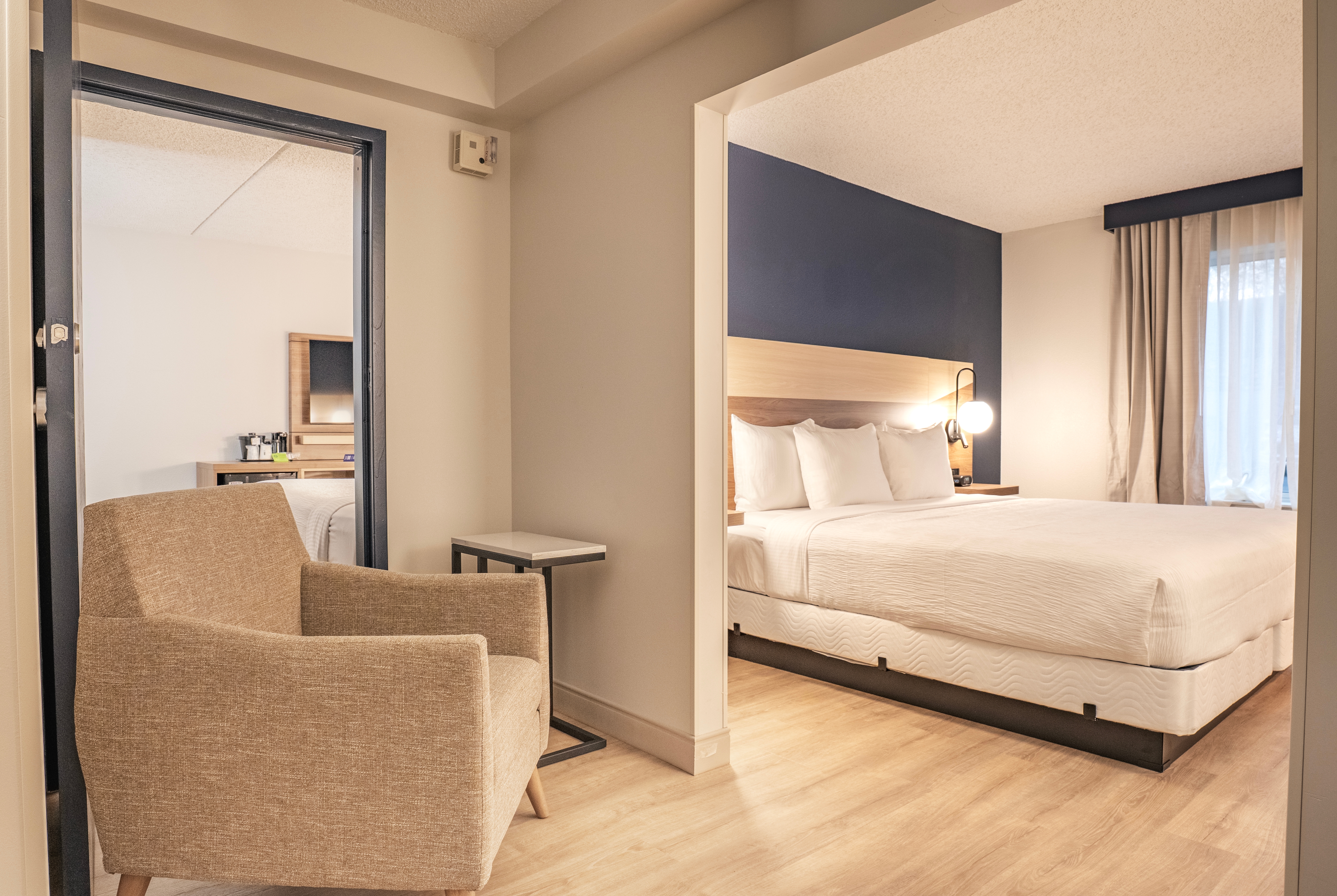 King bed guest room at the La Quinta Inn & Suites by Wyndham Danbury in Danbury, Connecticut