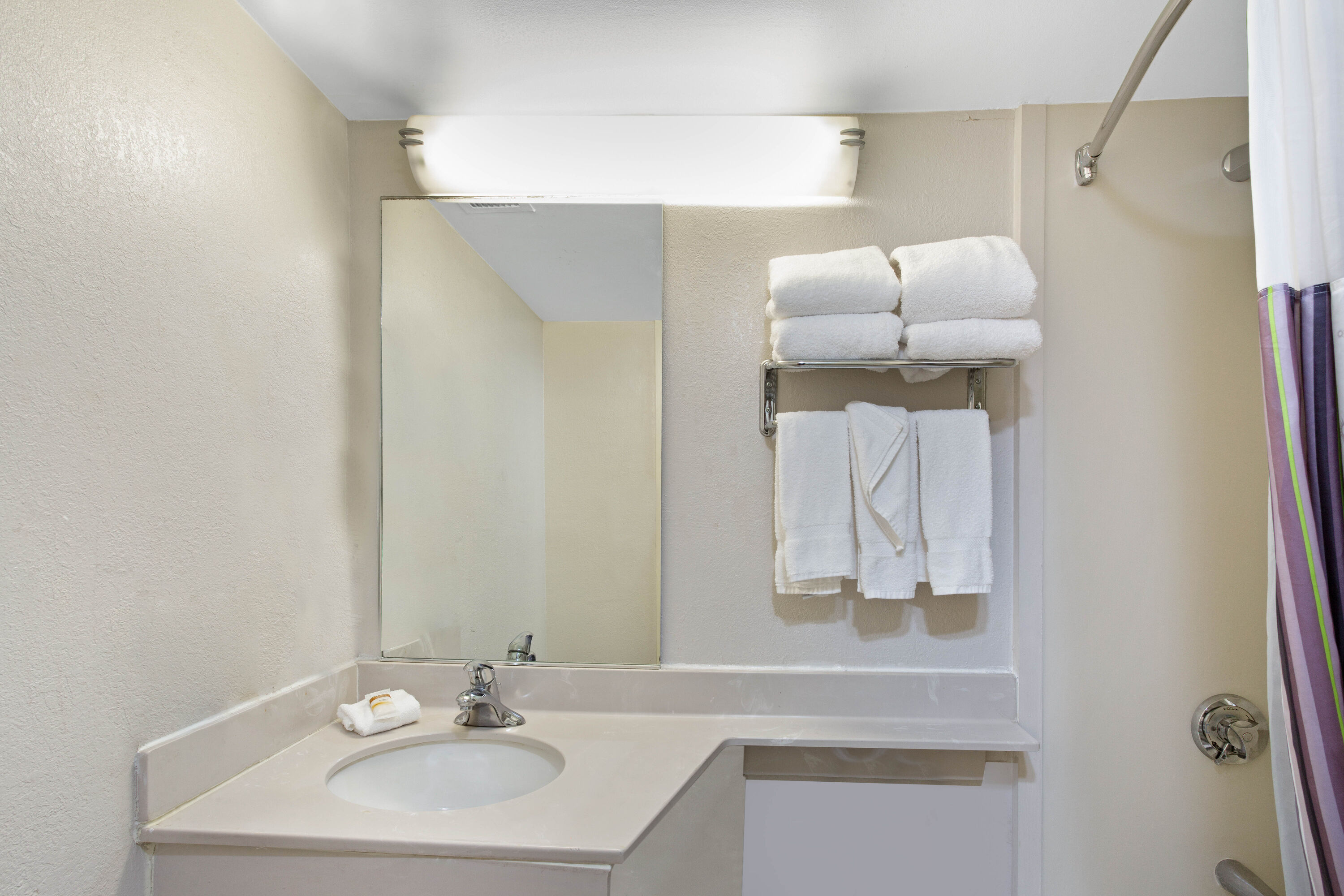 Guest room bath at the La Quinta Inn & Suites by Wyndham New Haven in New Haven, Connecticut