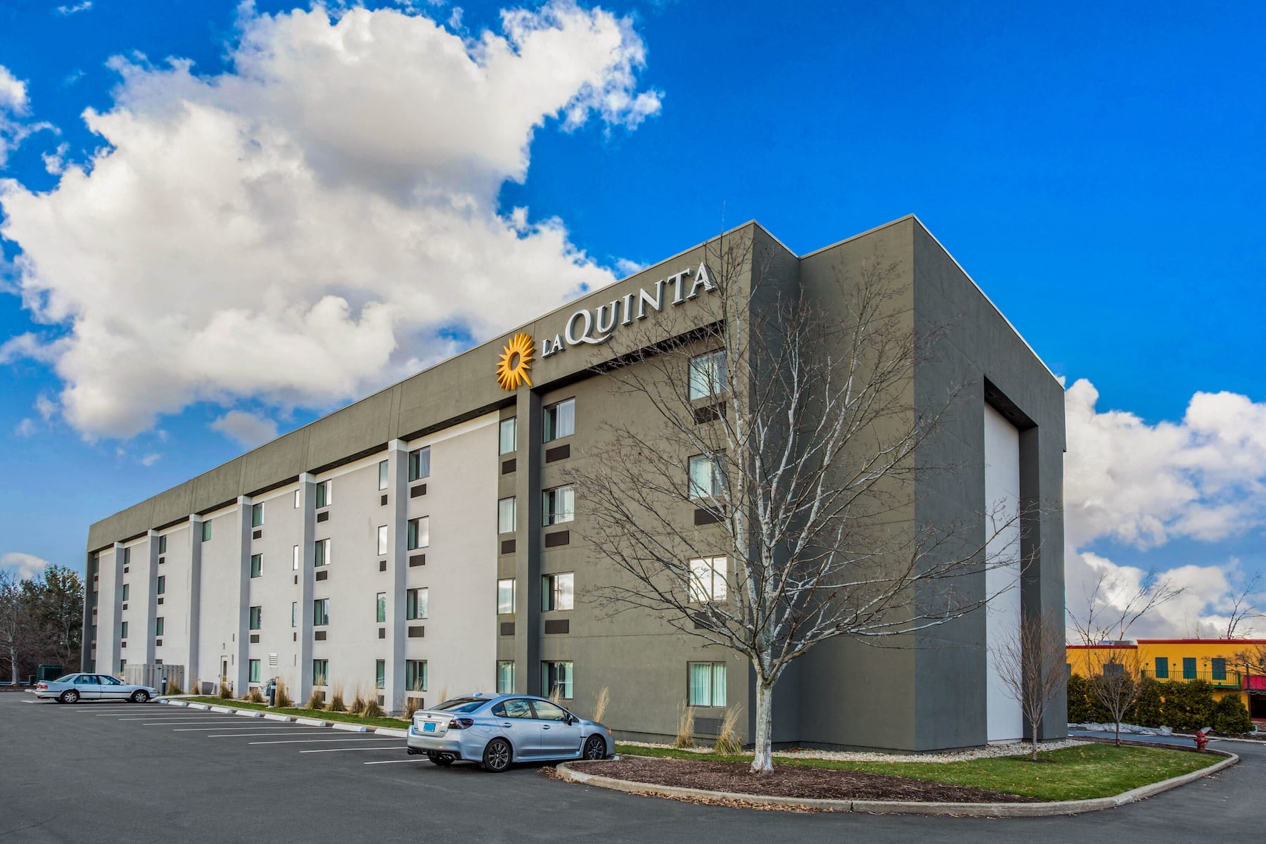 Exterior Day Image of La Quinta Inn & Suites by Wyndham Hartford - Bradley Airport hotel in Windsor Locks, Connecticut