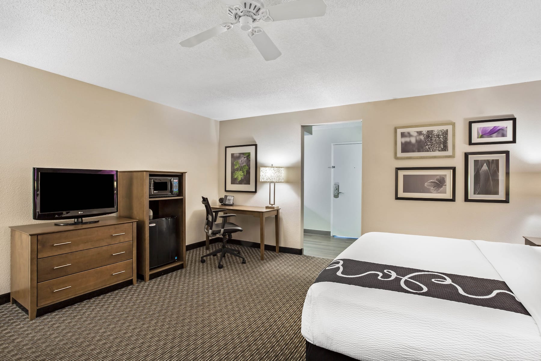 Guest room at the La Quinta Inn & Suites by Wyndham Hartford - Bradley Airport in Windsor Locks, Connecticut