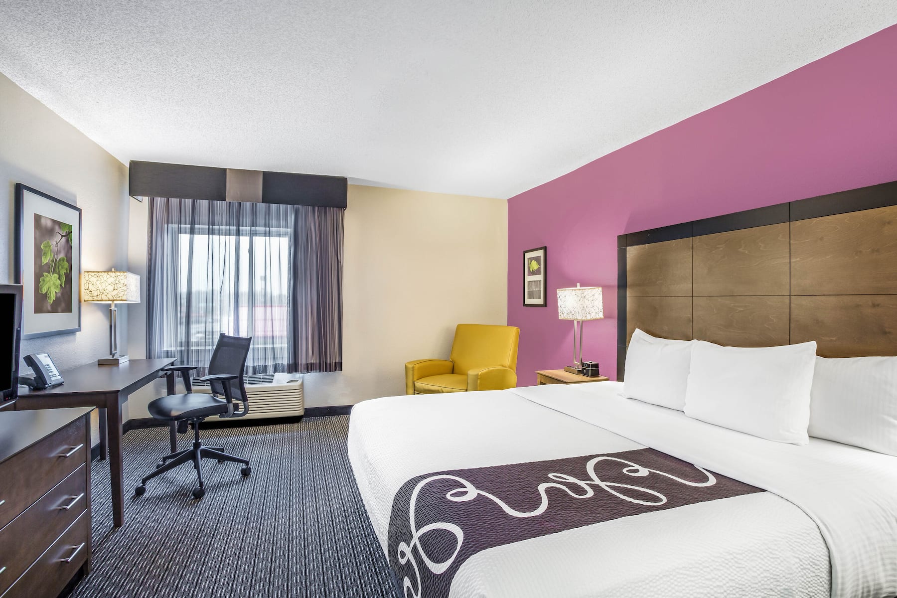 Guest room at the La Quinta Inn & Suites by Wyndham Hartford - Bradley Airport in Windsor Locks, Connecticut