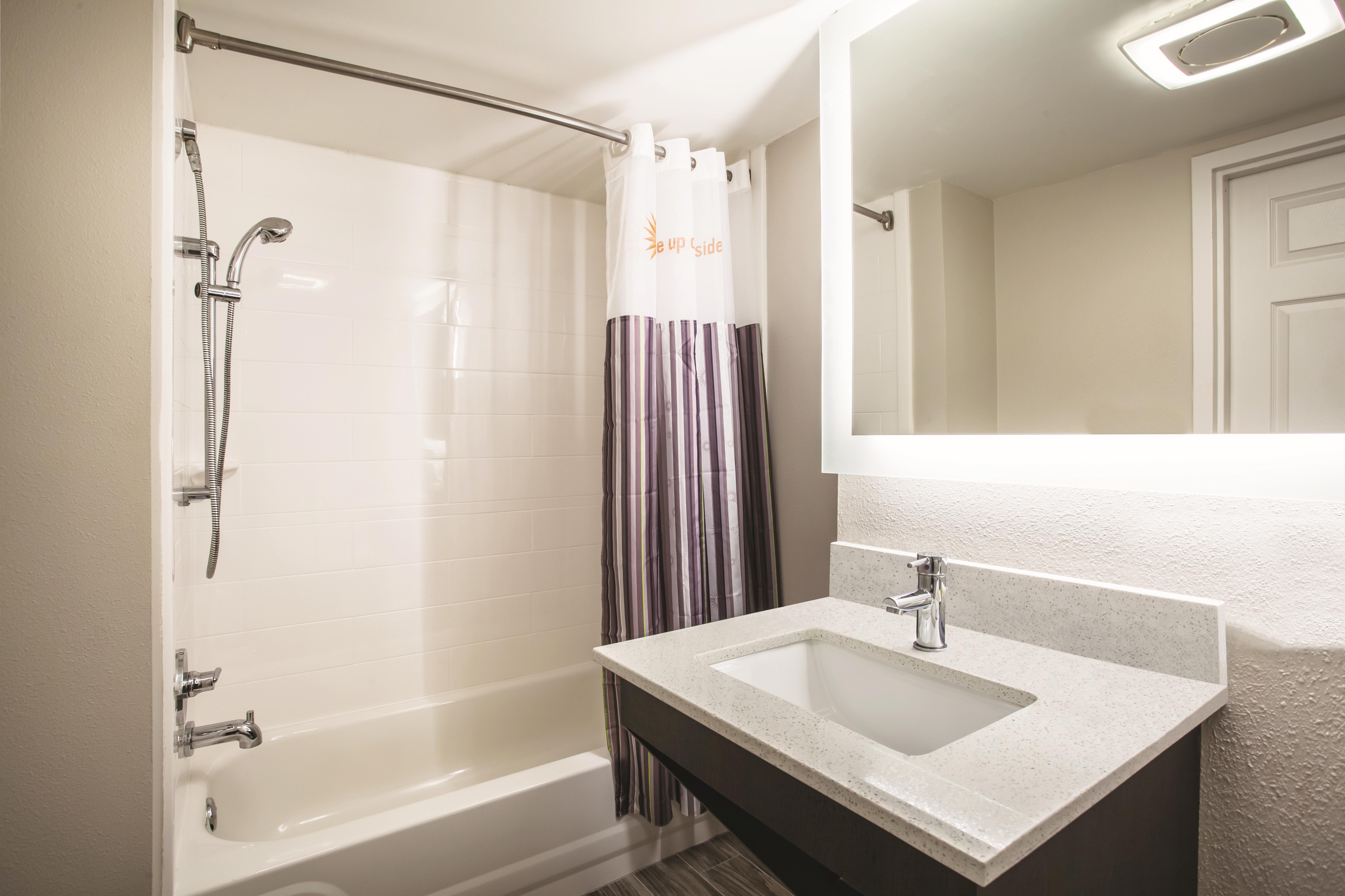 Guest room bath at the La Quinta Inn & Suites by Wyndham Clearwater South in Clearwater, Florida