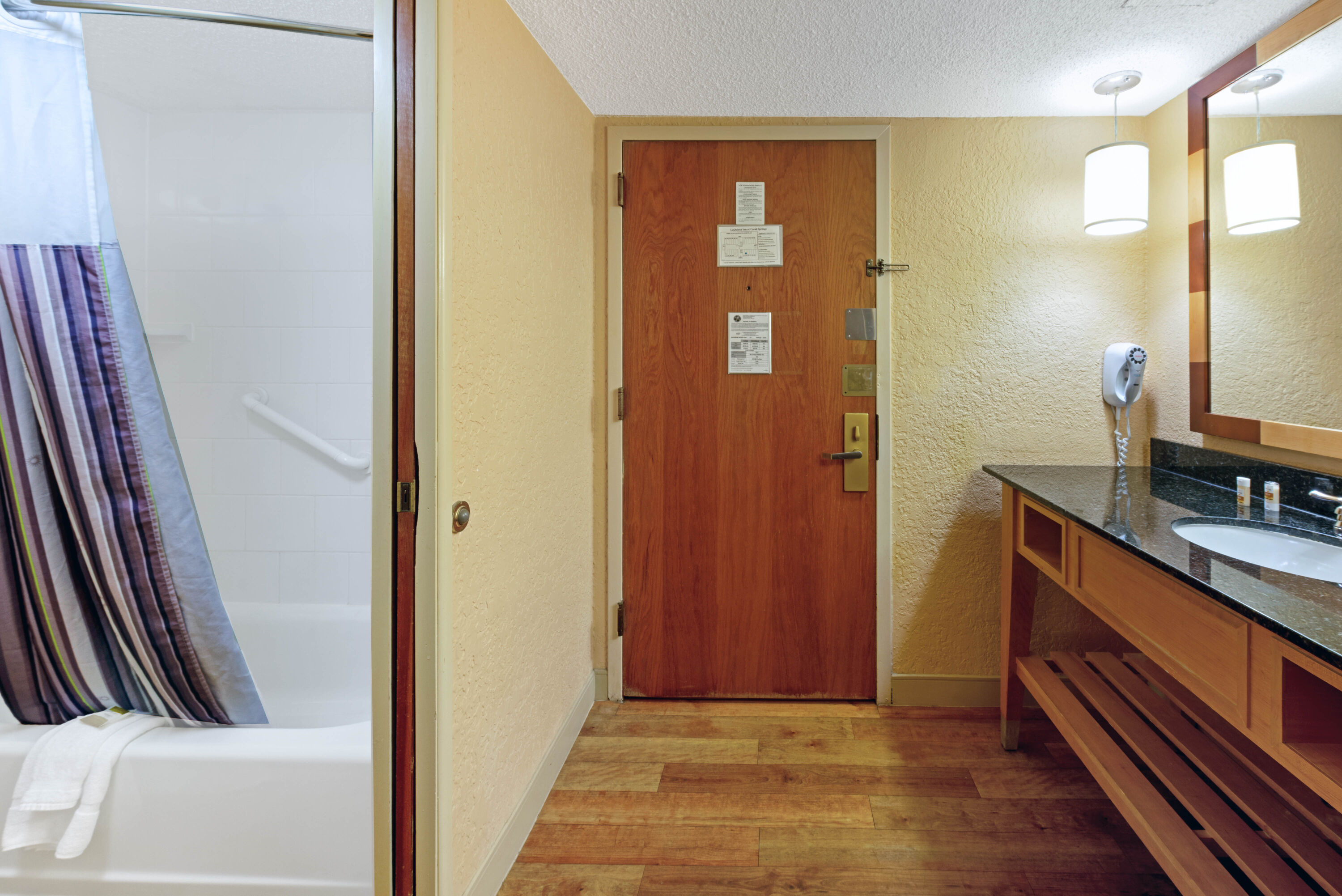 Guest room bath at the La Quinta Inn & Suites by Wyndham Coral Springs South in Coral Springs, Florida