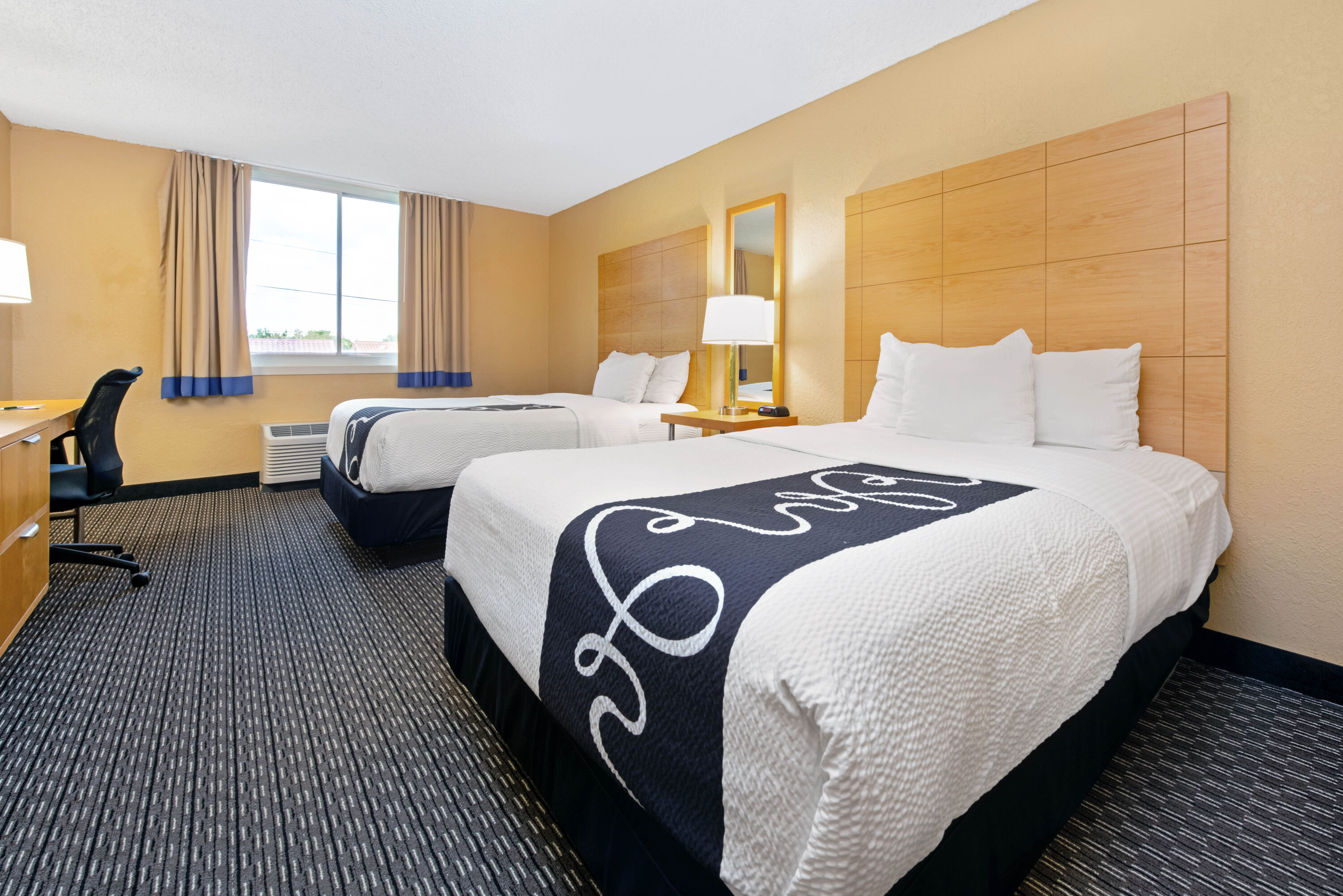 Guest room at the La Quinta Inn & Suites by Wyndham Coral Springs South in Coral Springs, Florida