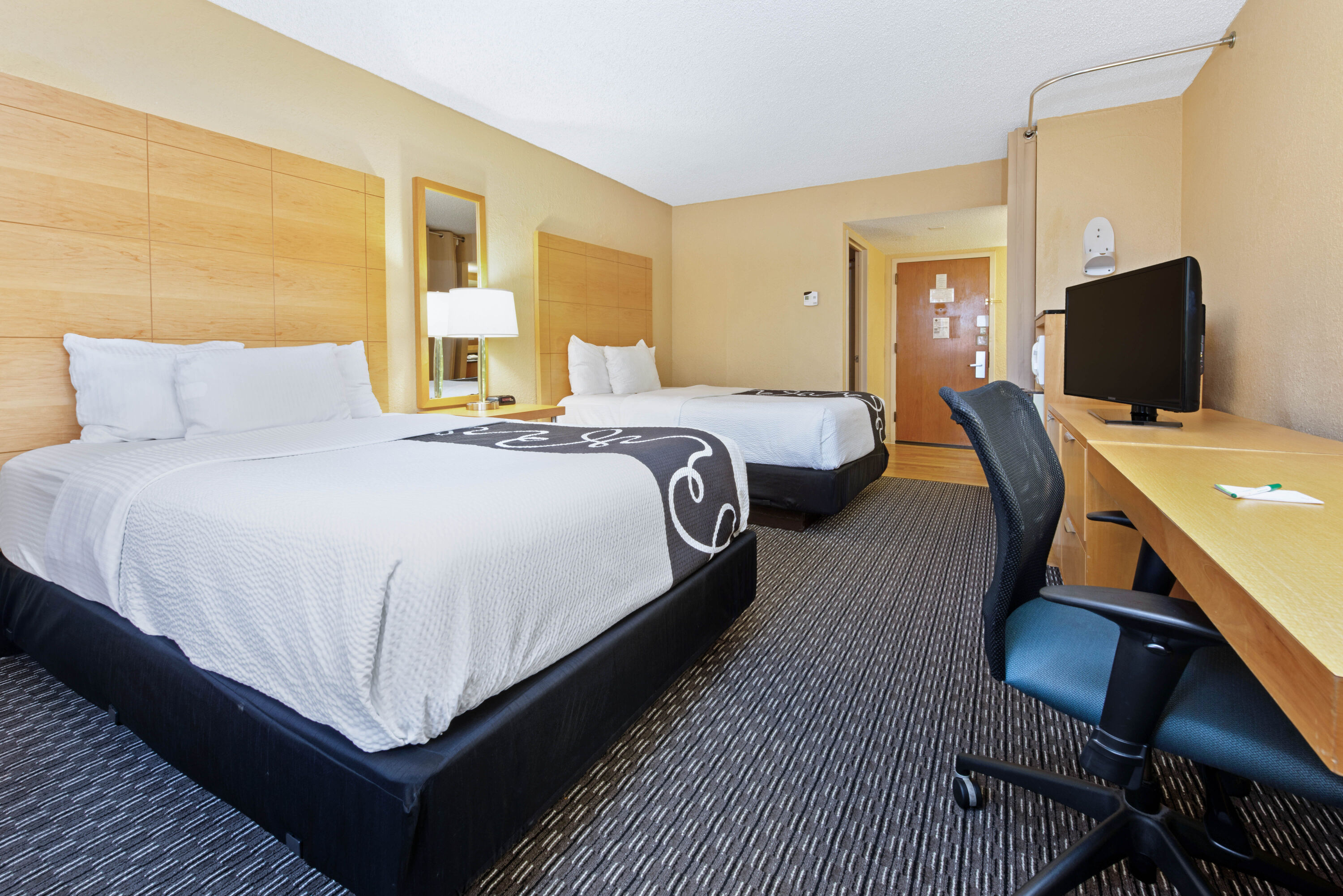 Guest room at the La Quinta Inn & Suites by Wyndham Coral Springs South in Coral Springs, Florida