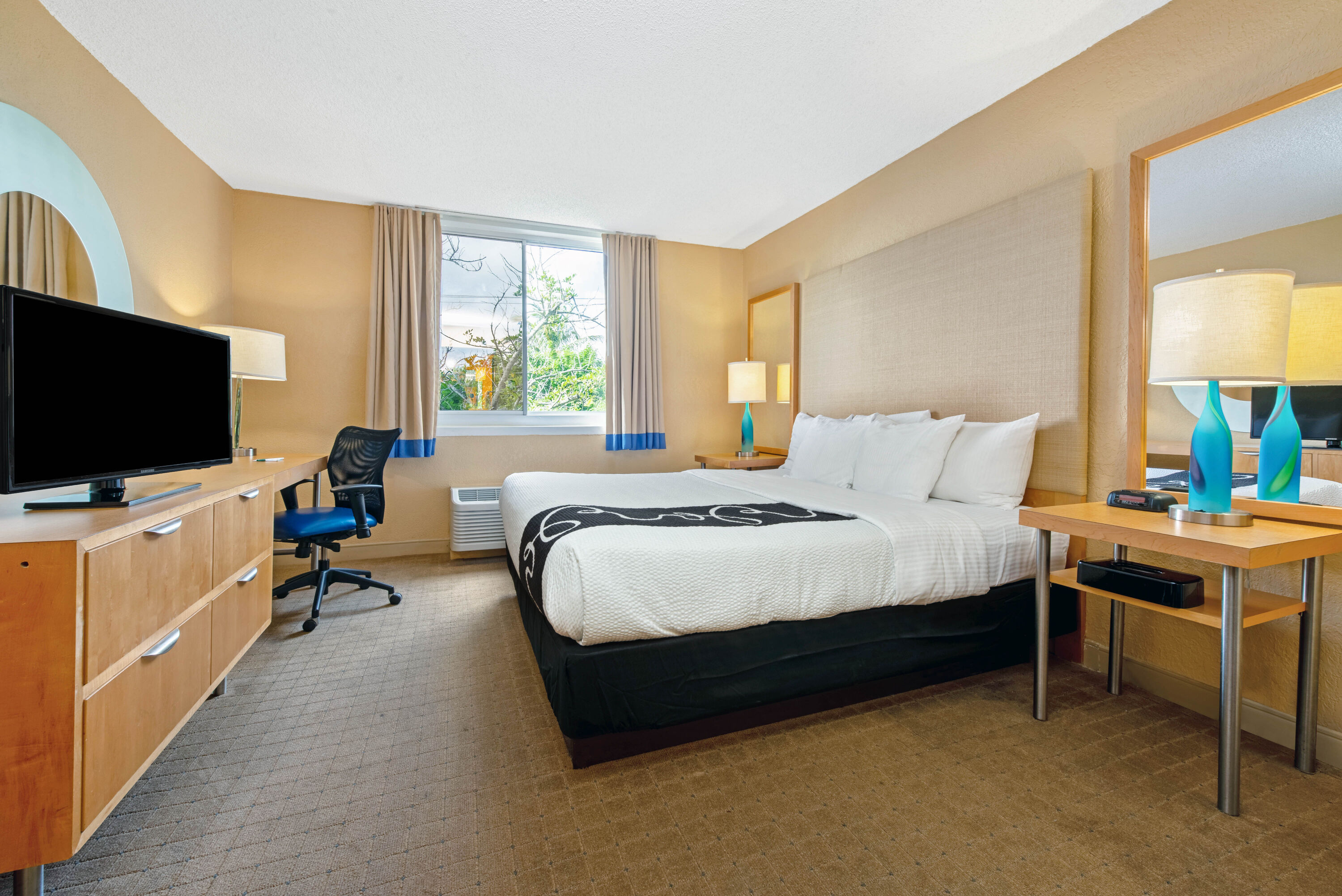 Guest room at the La Quinta Inn & Suites by Wyndham Coral Springs South in Coral Springs, Florida