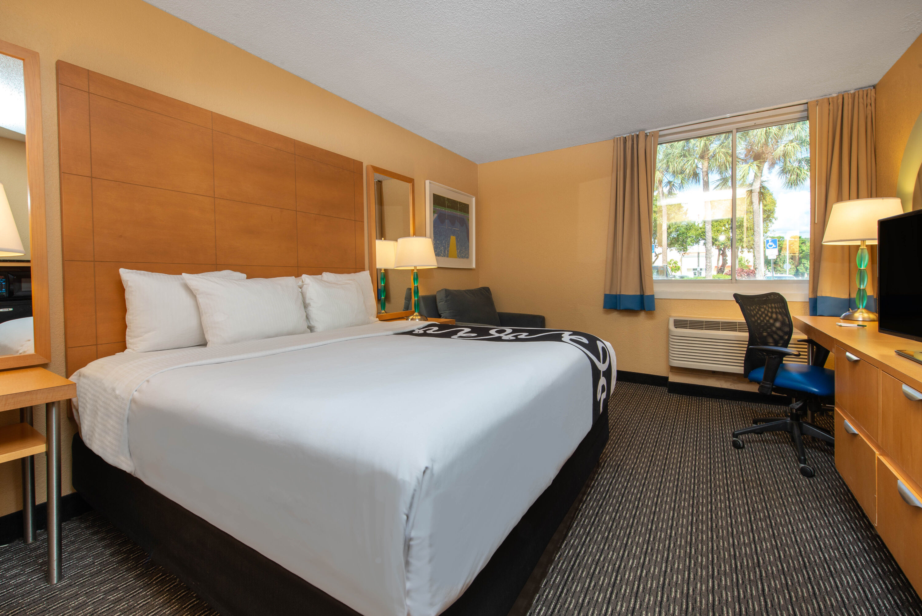 Guest room at the La Quinta Inn & Suites by Wyndham Deerfield Beach I-95 in Deerfield Beach, Florida