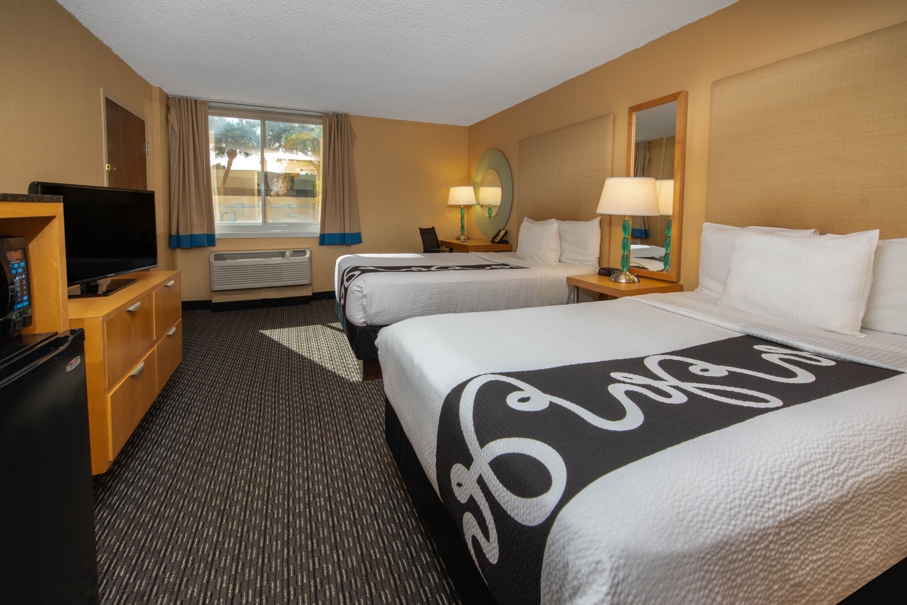 Guest room at the La Quinta Inn & Suites by Wyndham Deerfield Beach I-95 in Deerfield Beach, Florida