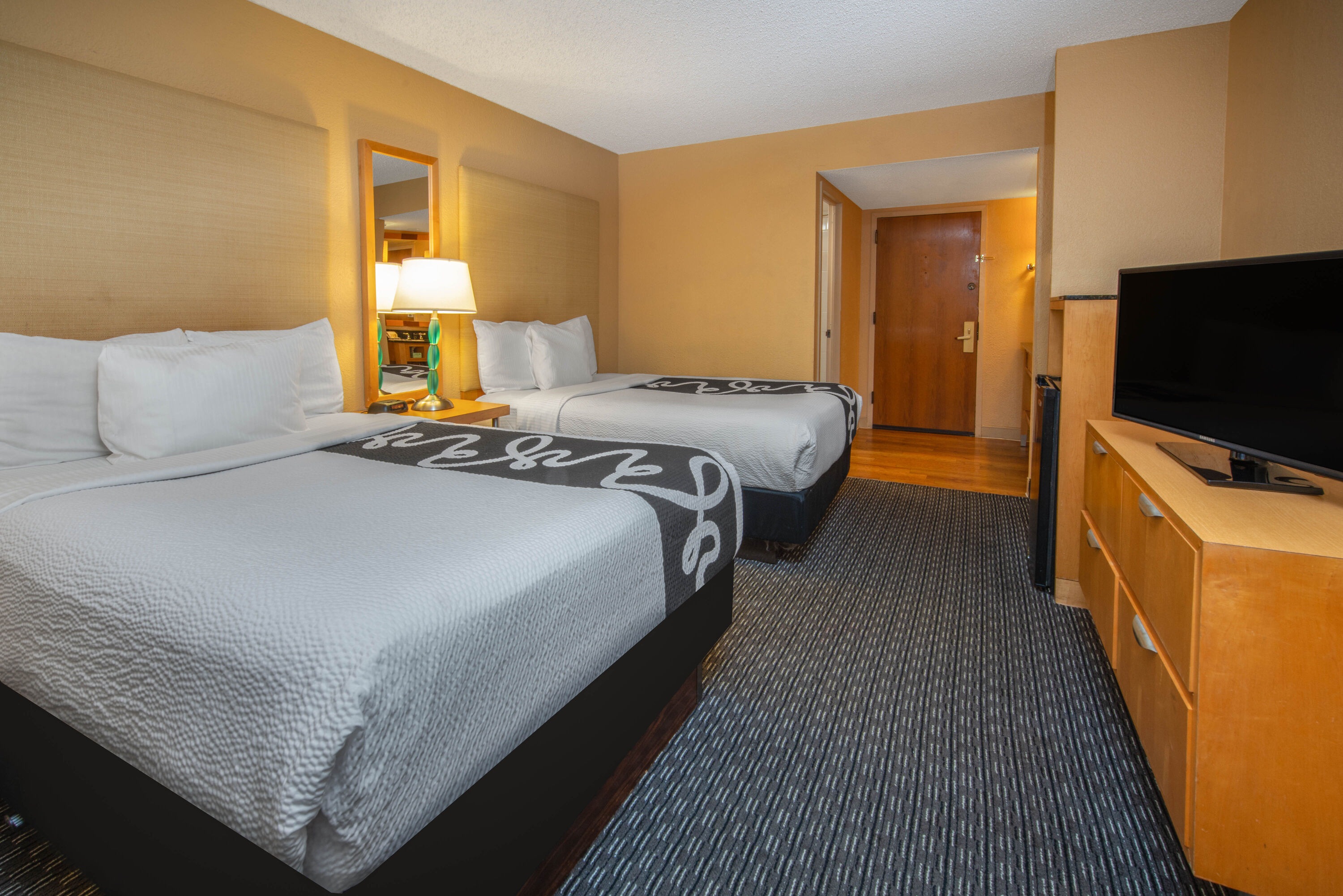 Guest room at the La Quinta Inn & Suites by Wyndham Deerfield Beach I-95 in Deerfield Beach, Florida