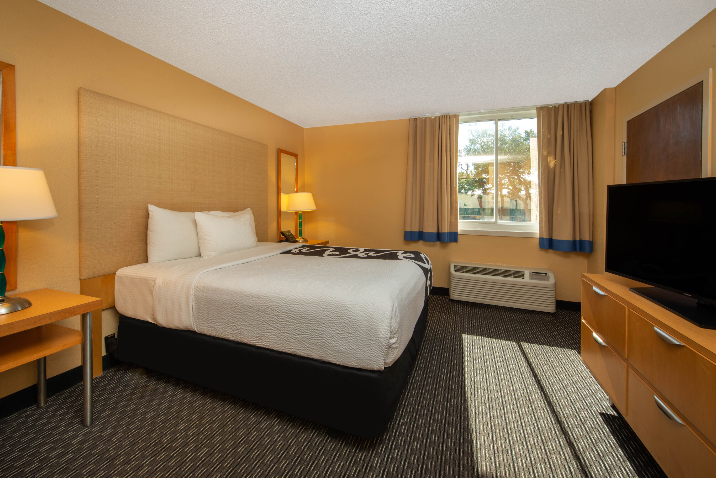 Guest room at the La Quinta Inn & Suites by Wyndham Deerfield Beach I-95 in Deerfield Beach, Florida