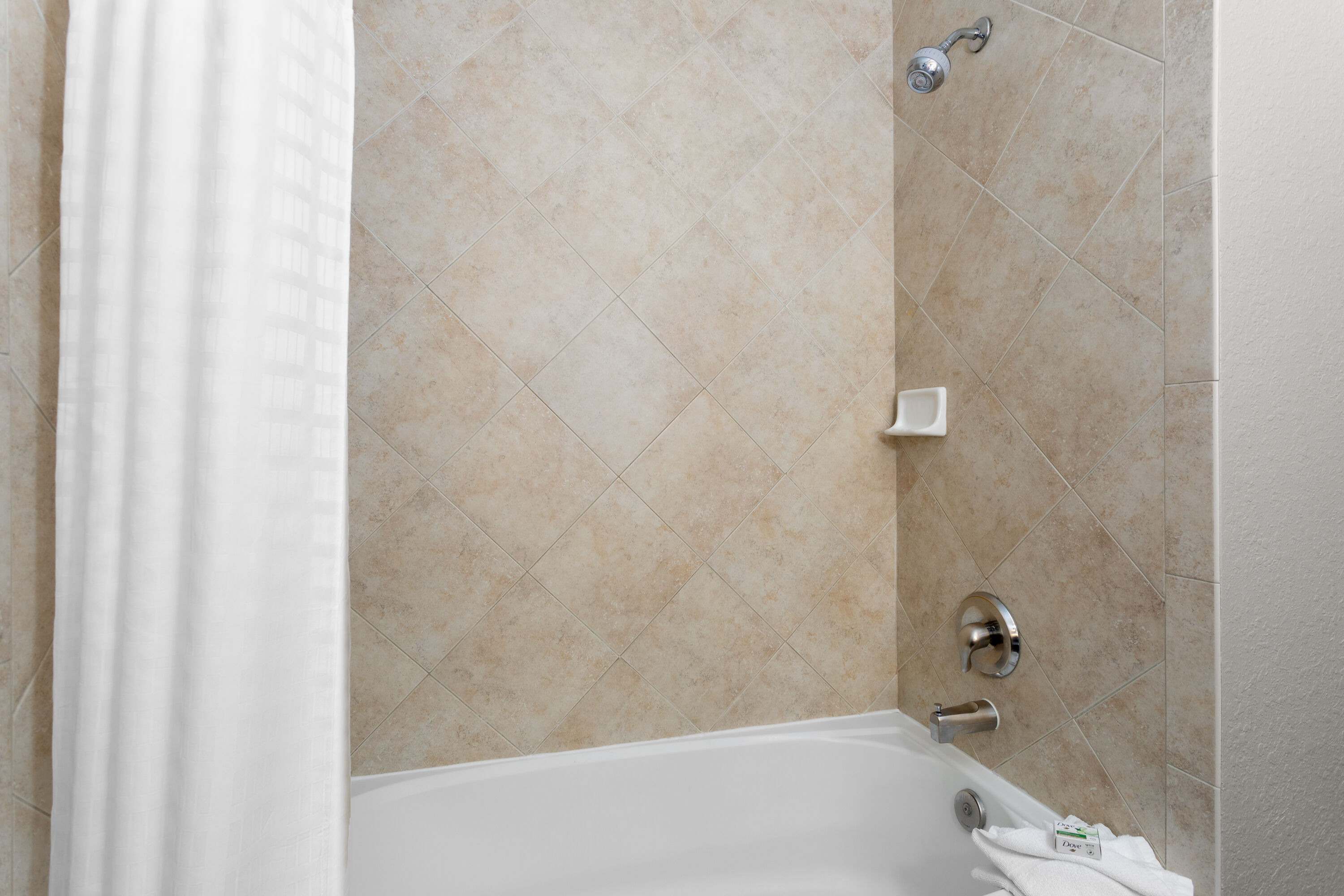 Guest room bath at the La Quinta Inn & Suites by Wyndham Ft. Pierce in Fort Pierce, Florida