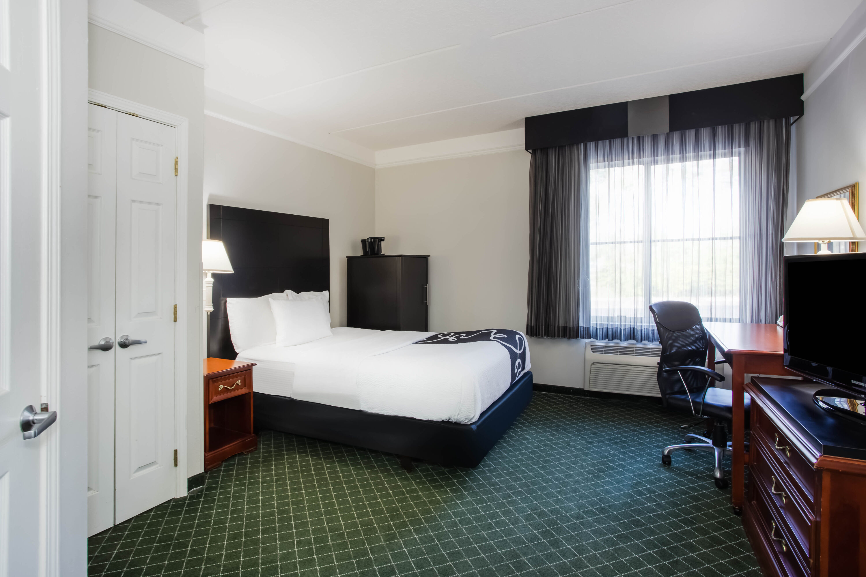 Guest room at the La Quinta Inn & Suites by Wyndham Melbourne Viera in Melbourne, Florida