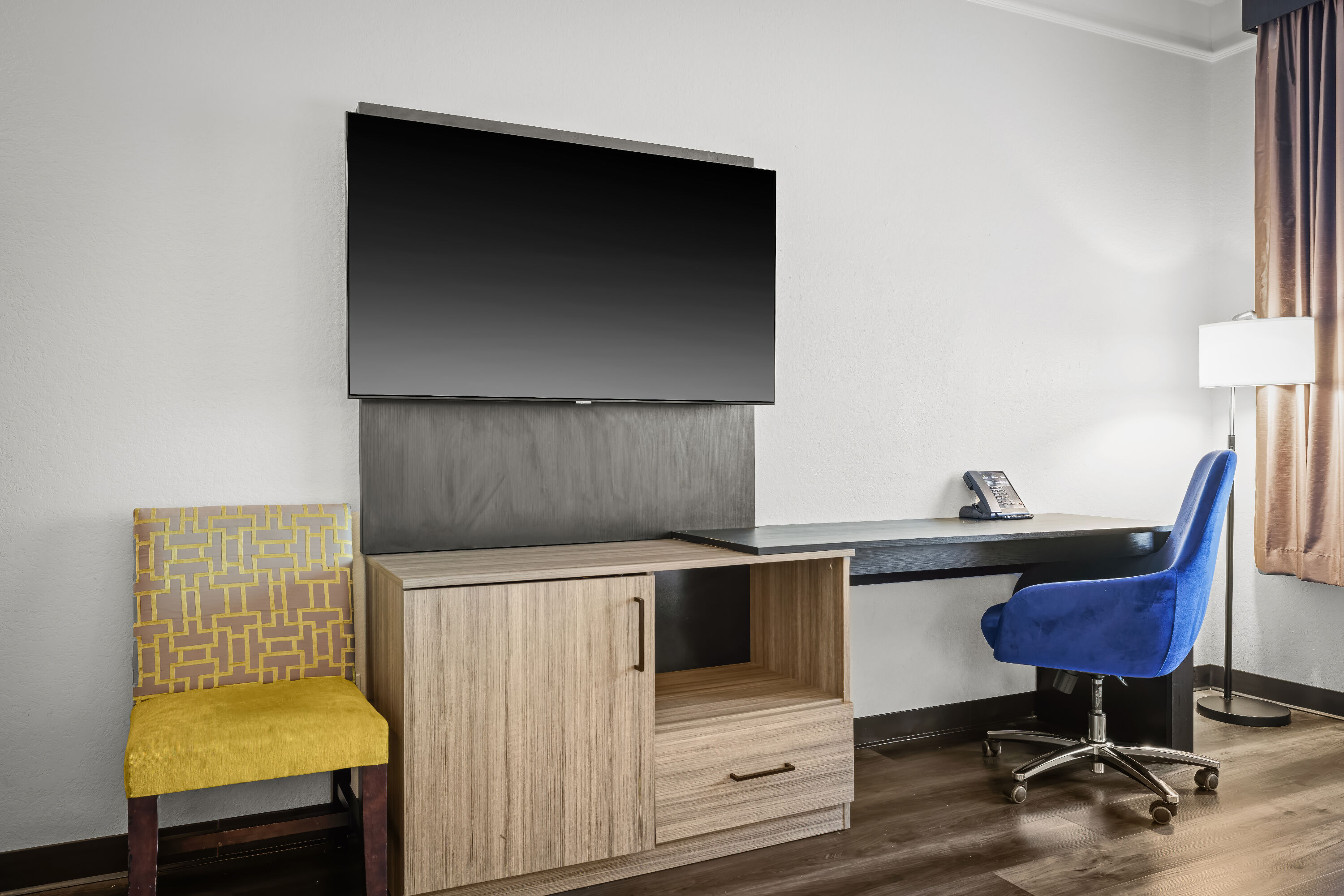 King bed guest room at the La Quinta Inn & Suites by Wyndham Miami Airport West in Miami, Florida