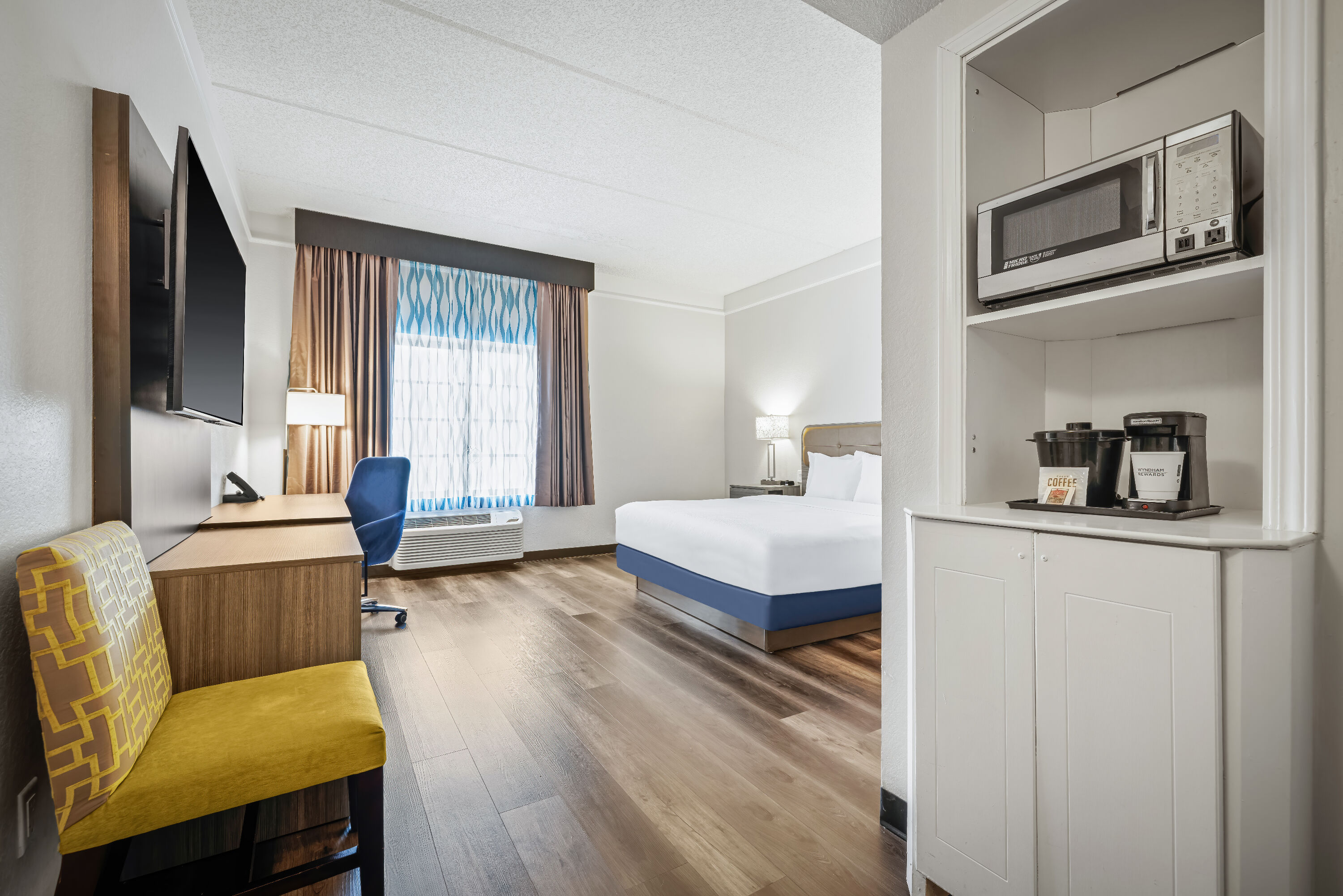 King bed guest room at the La Quinta Inn & Suites by Wyndham Miami Airport West in Miami, Florida