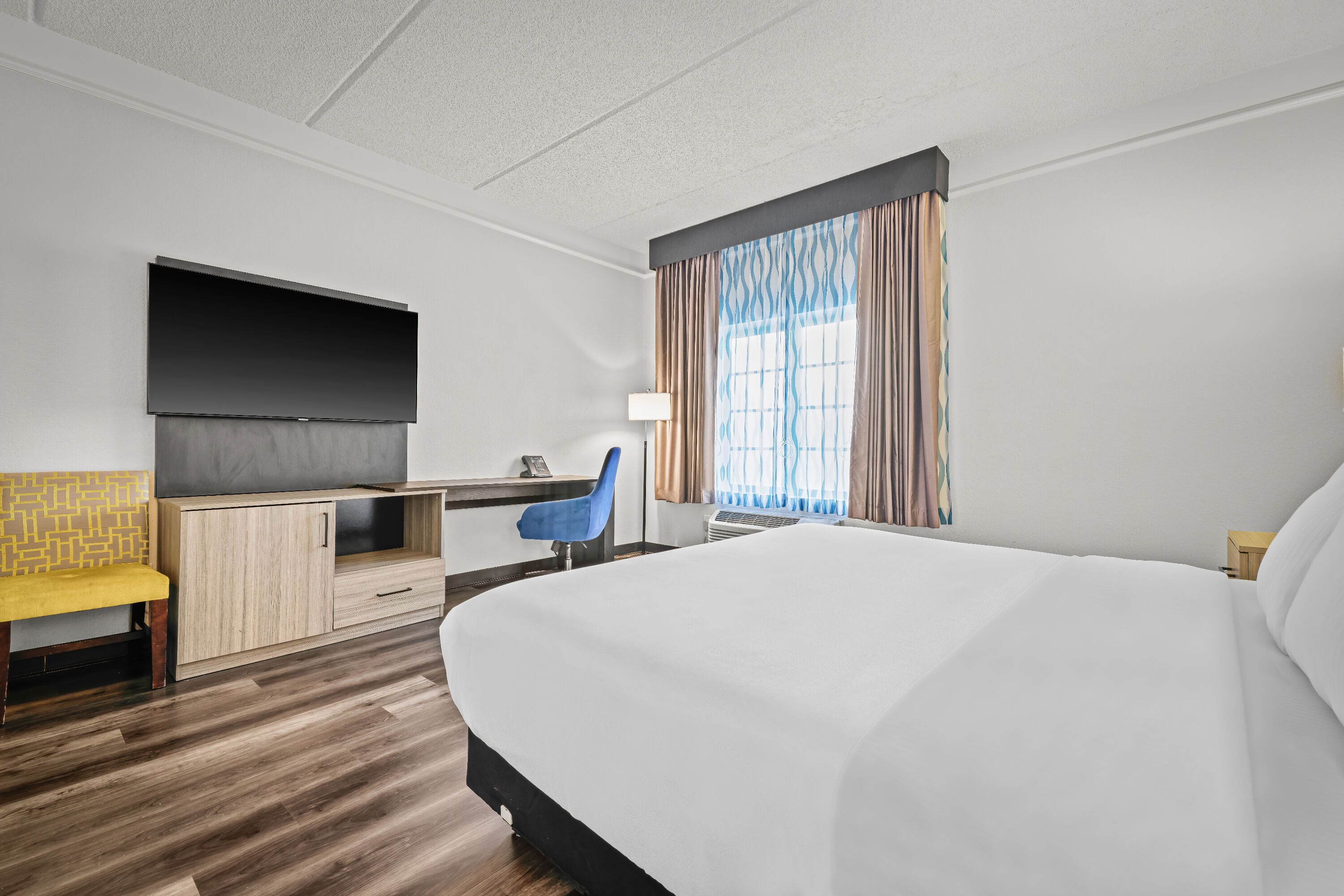 King bed guest room at the La Quinta Inn & Suites by Wyndham Miami Airport West in Miami, Florida