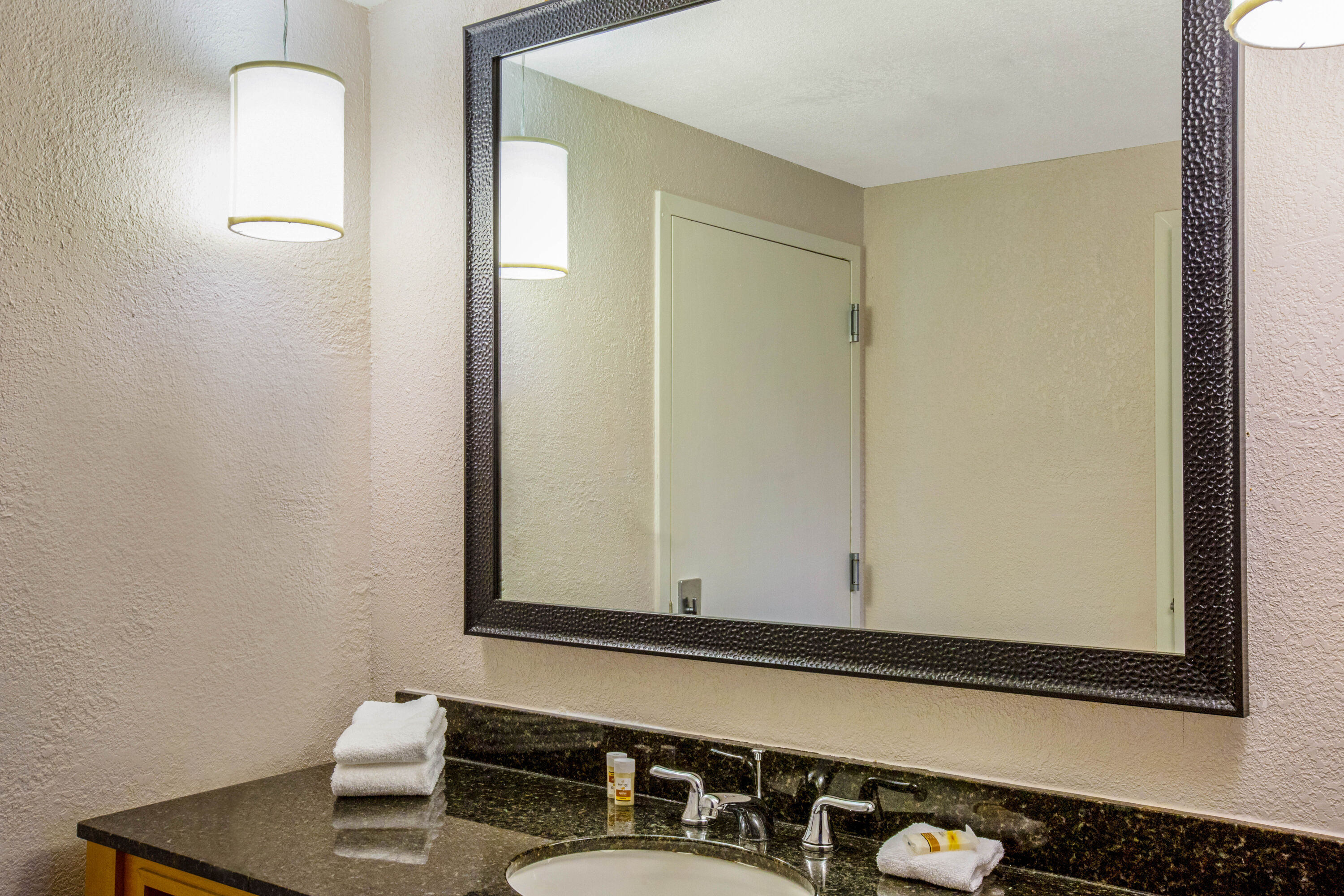 Guest room bath at the La Quinta Inn & Suites by Wyndham Miami Lakes in Miami, Florida
