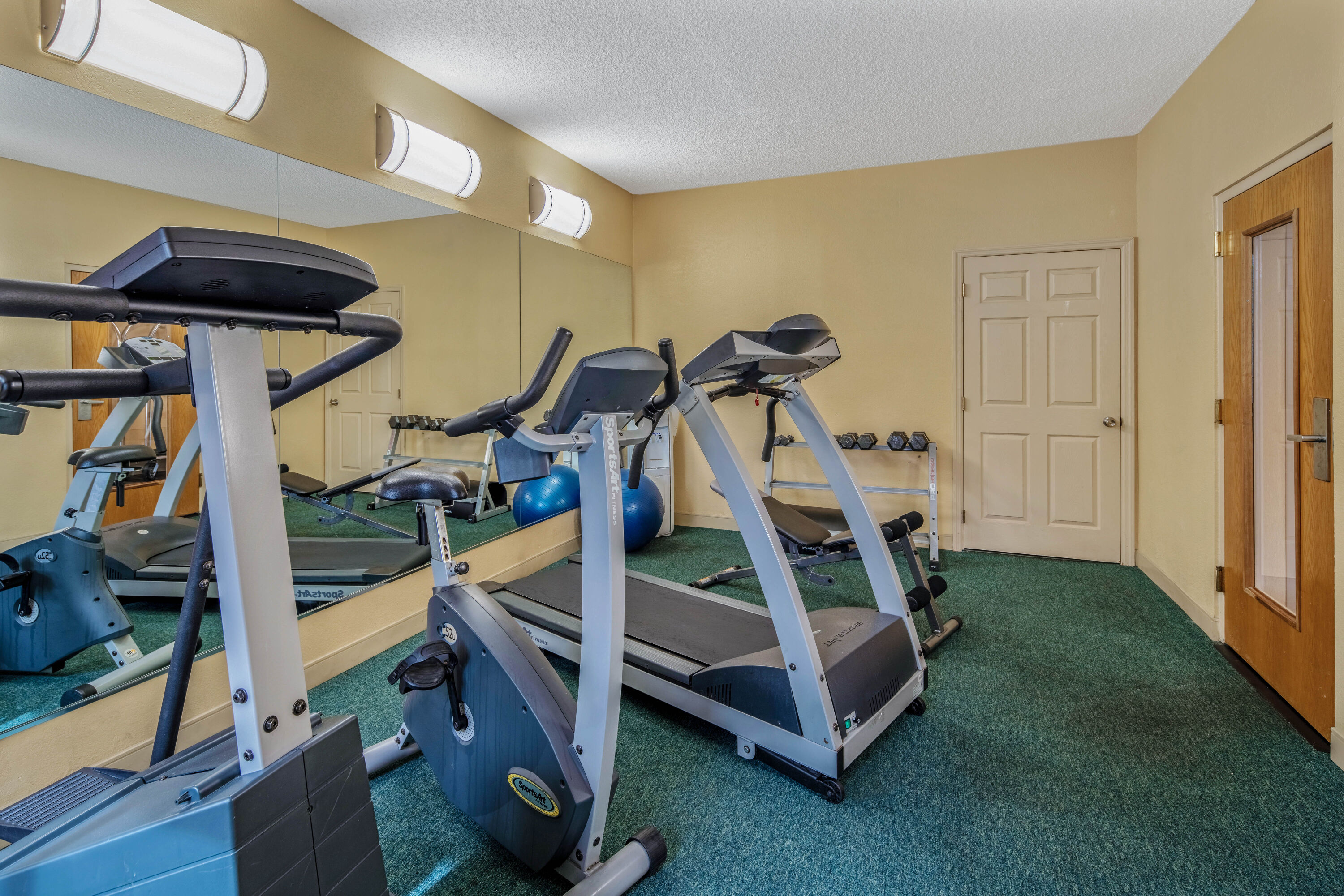 Fitness room at La Quinta Inn & Suites by Wyndham Naples Downtown in Naples, Florida