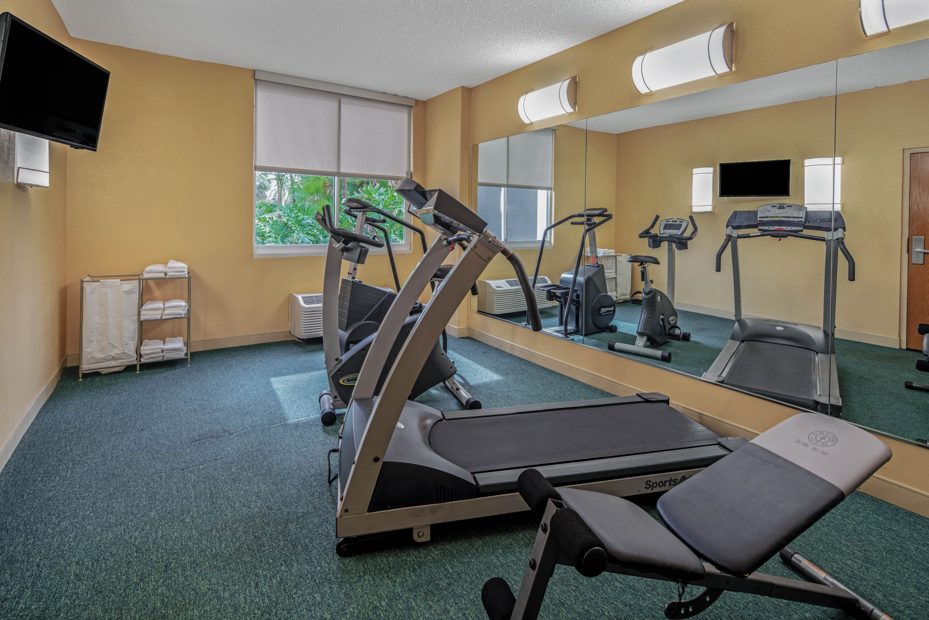 Fitness room at La Quinta Inn & Suites by Wyndham Naples Downtown in Naples, Florida