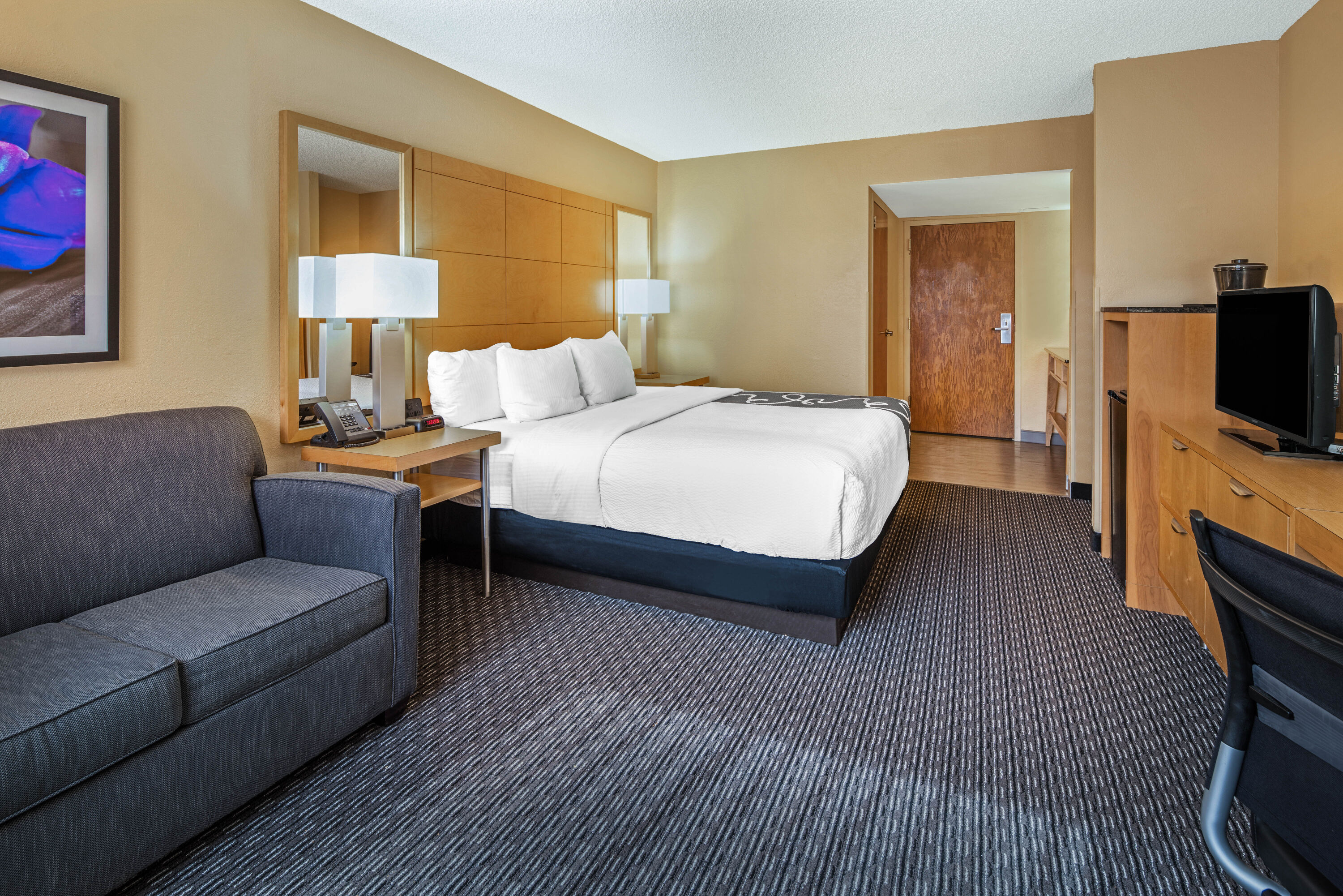 Guest room at the La Quinta Inn & Suites by Wyndham Naples Downtown in Naples, Florida